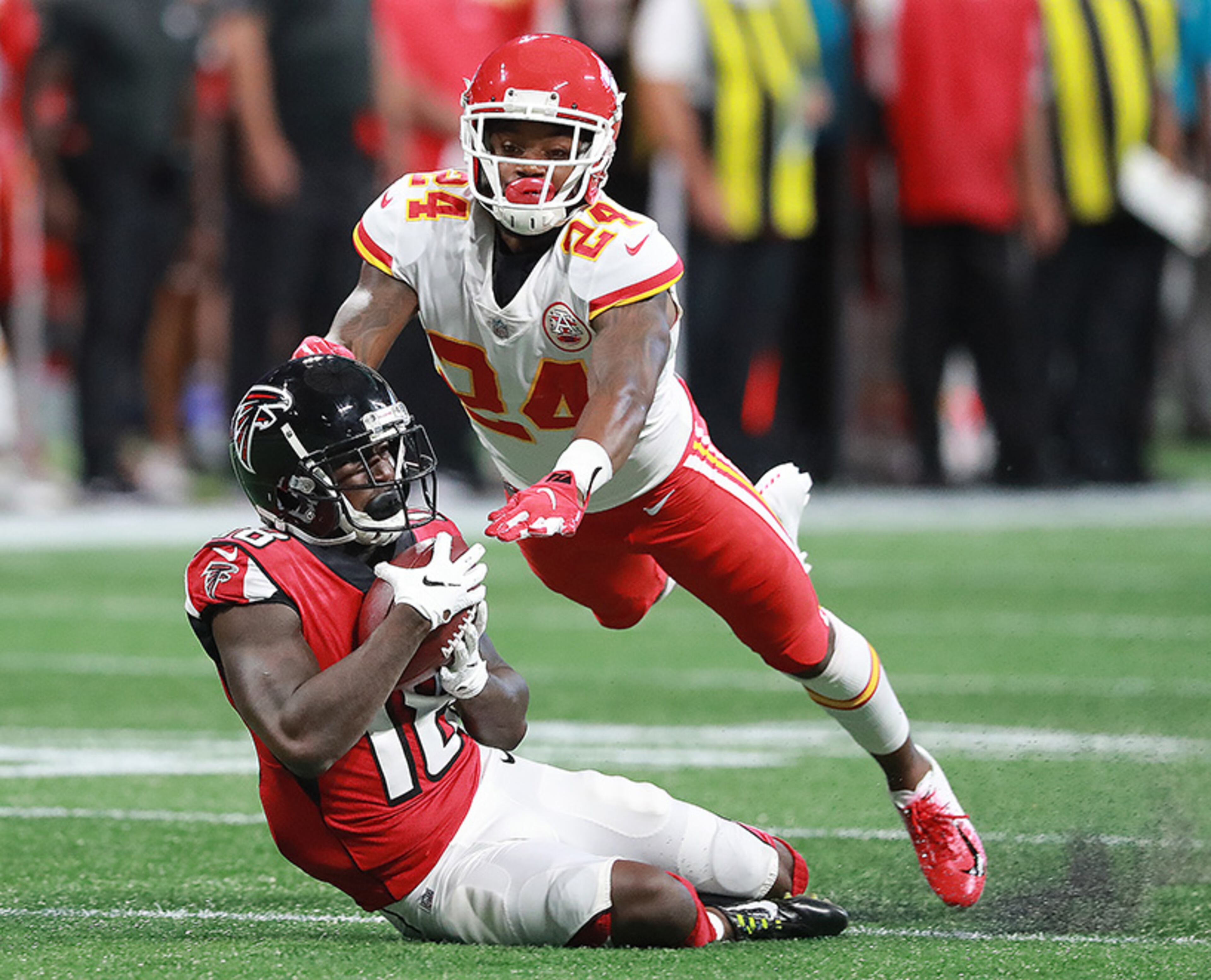 Falcons first-round draft pick, wide receiver Calvin Ridley, catches a long pass ahead of Chiefs cornerback David Amerson for a first down during the first quarter Friday, Aug.17, 2018, at Mercedes-Benz Stadium in Atlanta.