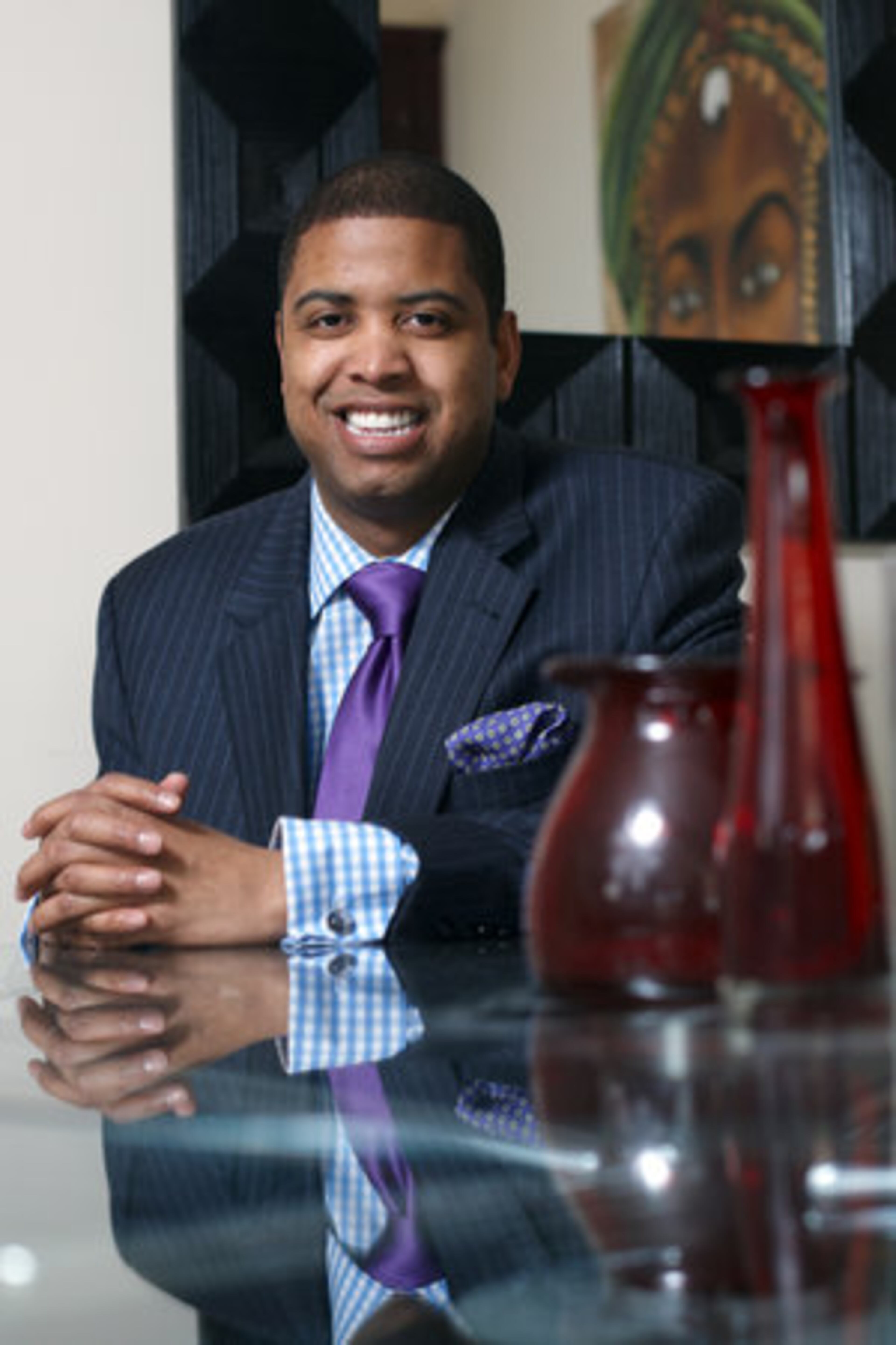 WEAKNESS: Loafers." Garth wears a JoS. A. Bank suit with a T.M. Lewin dress shirt and David Donahue tie.