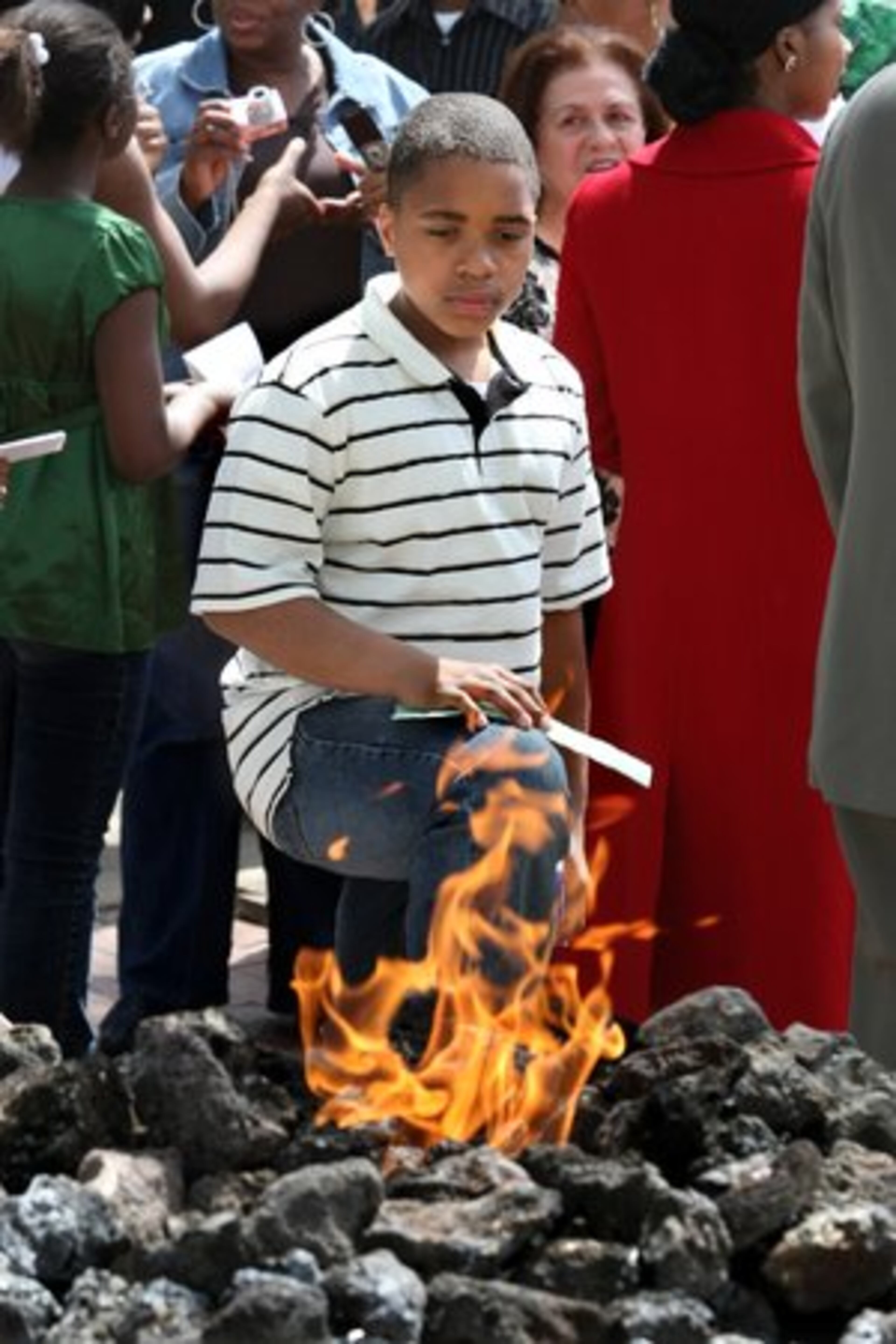Allen Walters, 11, from Charleston, S.C., takes in the new eternal flame. Allen is writing a report for his church on the history of Martin Luther King Jr.