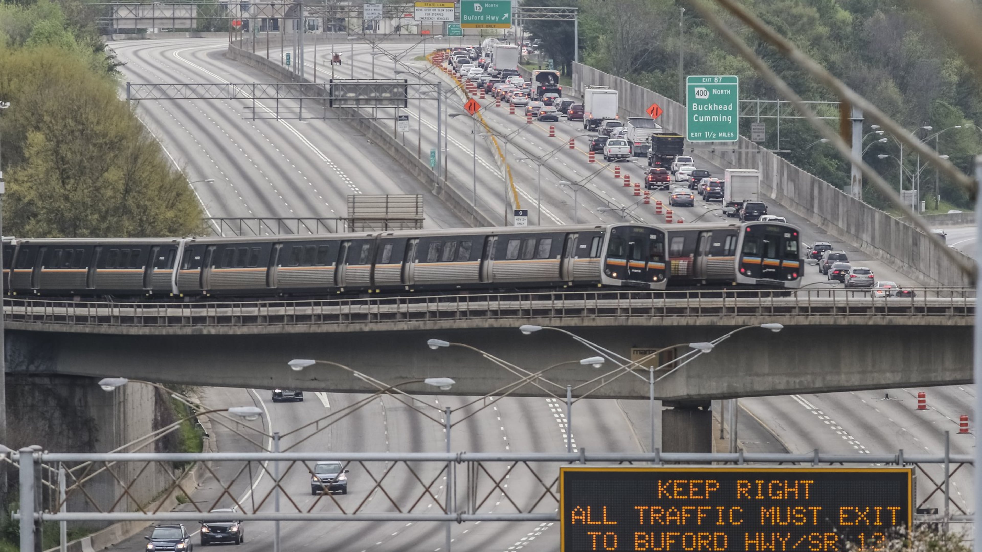 Traffic and congestion contribute to lower air quality, but a new Environmental Protection Agency report says metro Atlanta has met a more stringent standard for air pollution. JOHN SPINK /JSPINK@AJC.COM 1963833