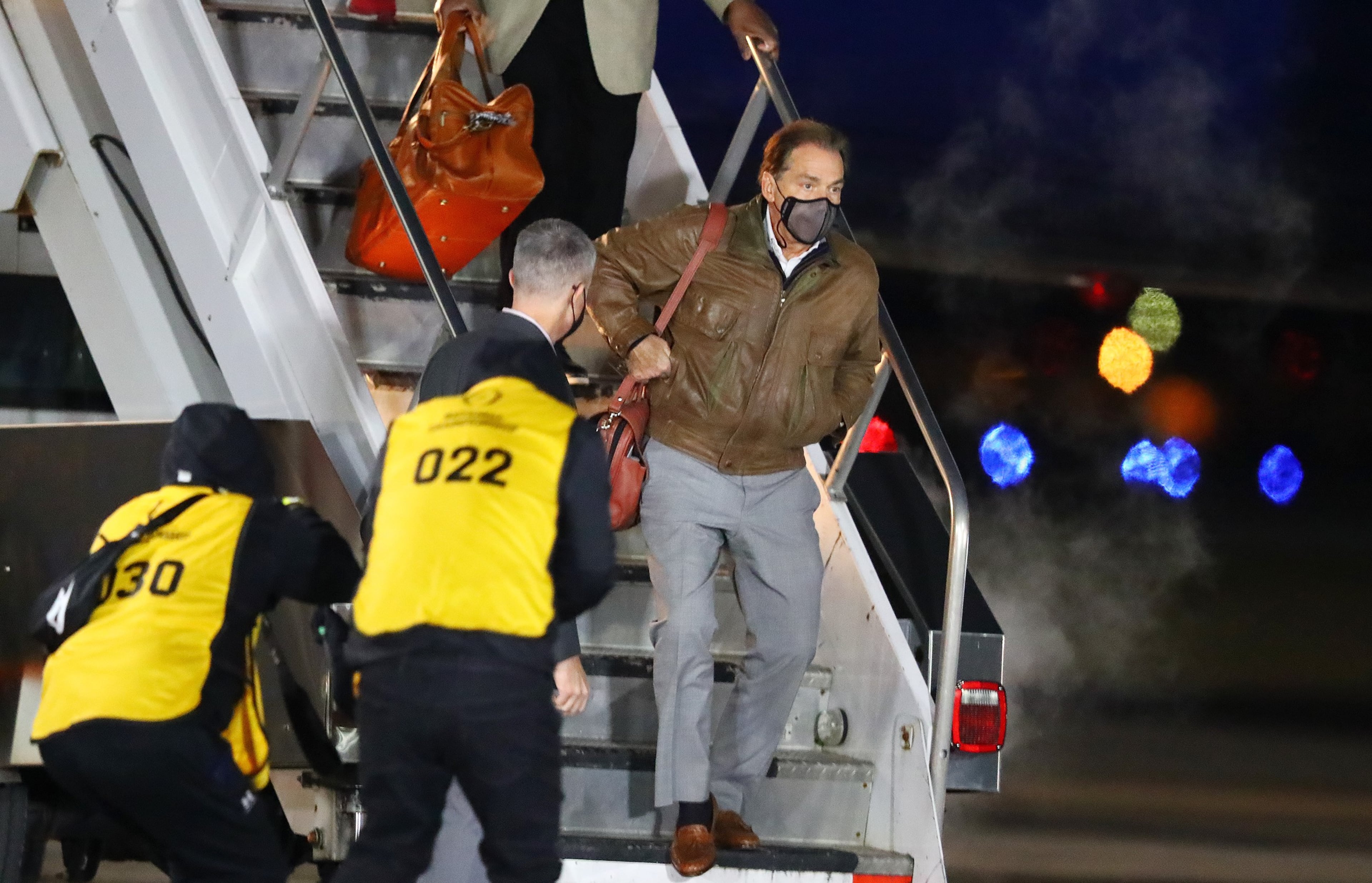 Curtis Compton's photo of Alabama coach Nick Saban exiting the plane after his team's arrival in Indianapolis for the 2022 College Football Playoff championship game against Georgia.