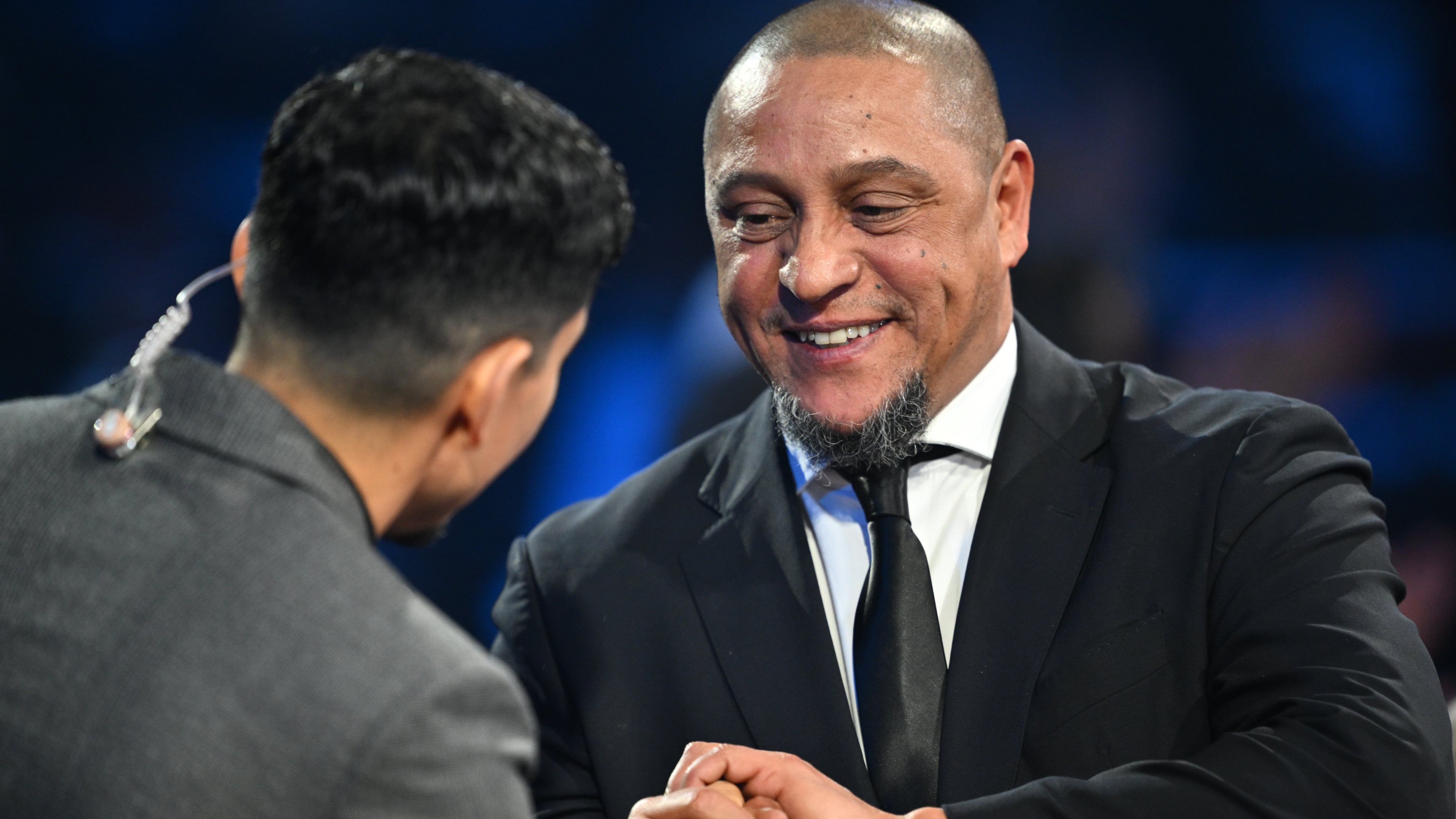 Former Brazil star Roberto Carlos is interviewed by actor Danny Ramirez during the draw for the 2026 soccer World Cup at the Kennedy Center in Washington, Friday, Dec. 5, 2025. (Mandel Ngan/Pool Photo via AP)