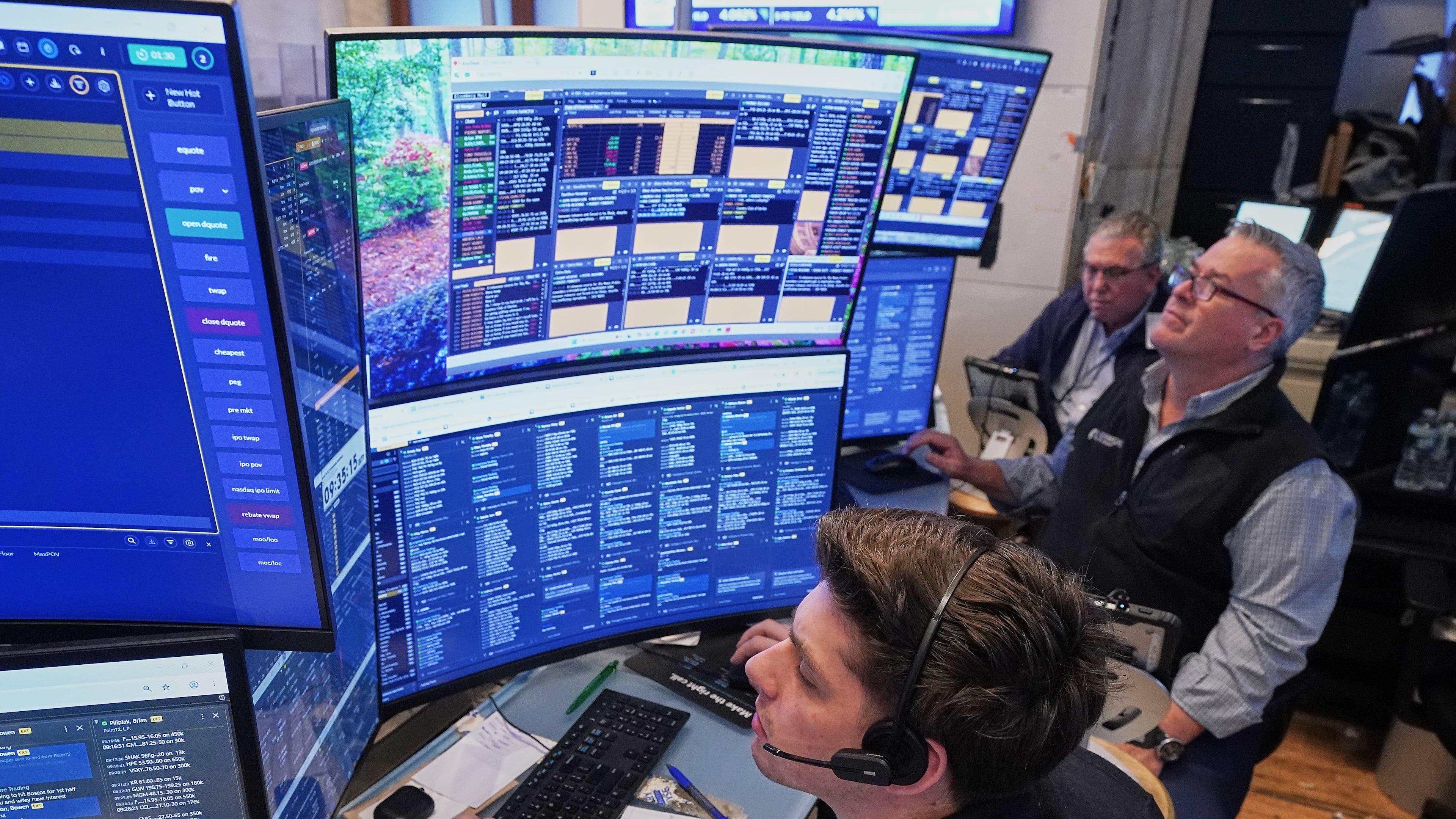 A trio of traders work on the floor of the New York Stock Exchange, Wednesday, June 3, 2026. (AP Photo/Richard Drew)
