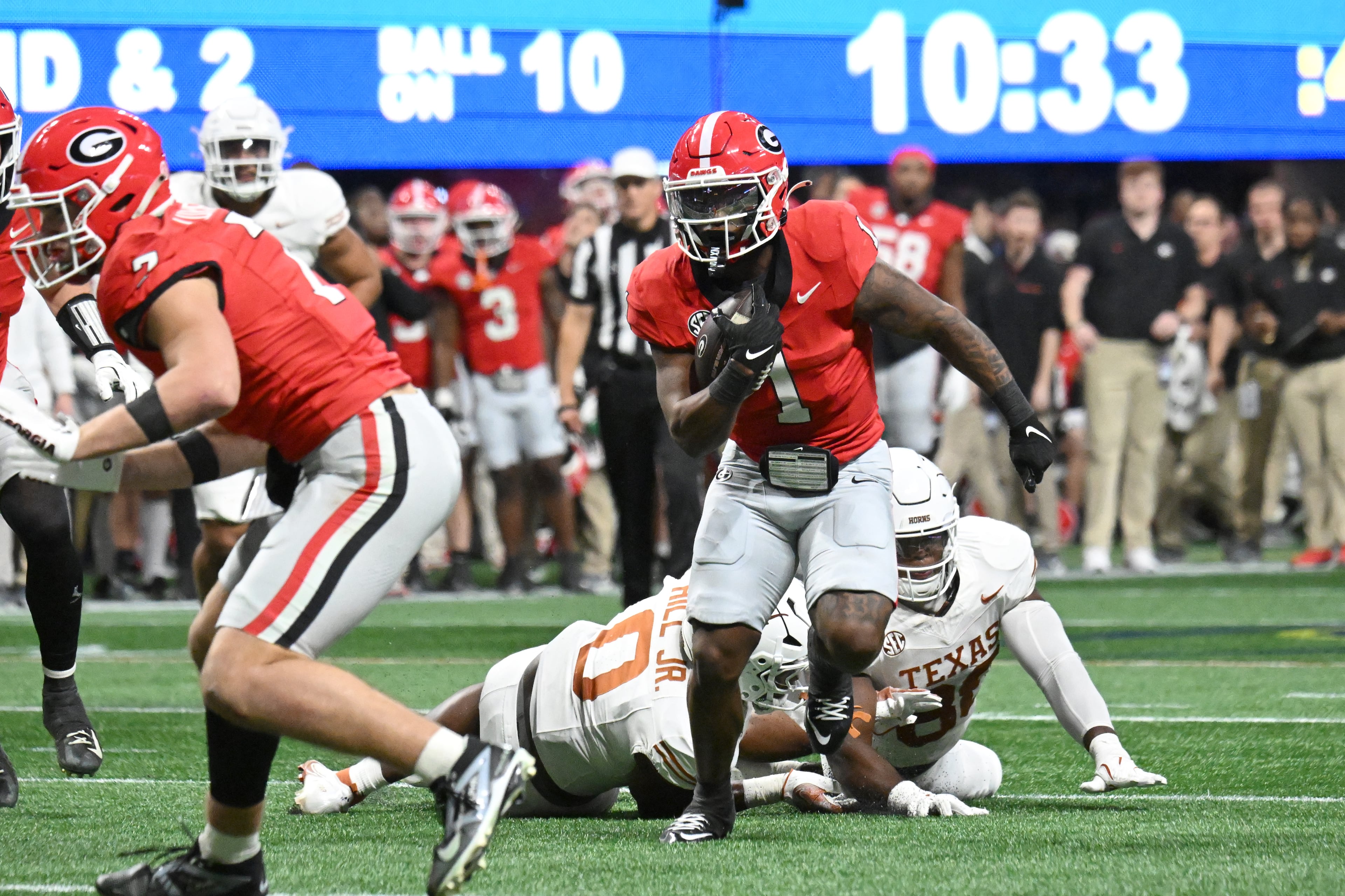 Georgia running back Trevor Etienne (1) runs for a touchdown during the second half in the SEC Championship football game at the Mercedes-Benz Stadium, Saturday, December 7, 2024, in Atlanta. Georgia won 22-19 over Texas in overtime. (Hyosub Shin / AJC)