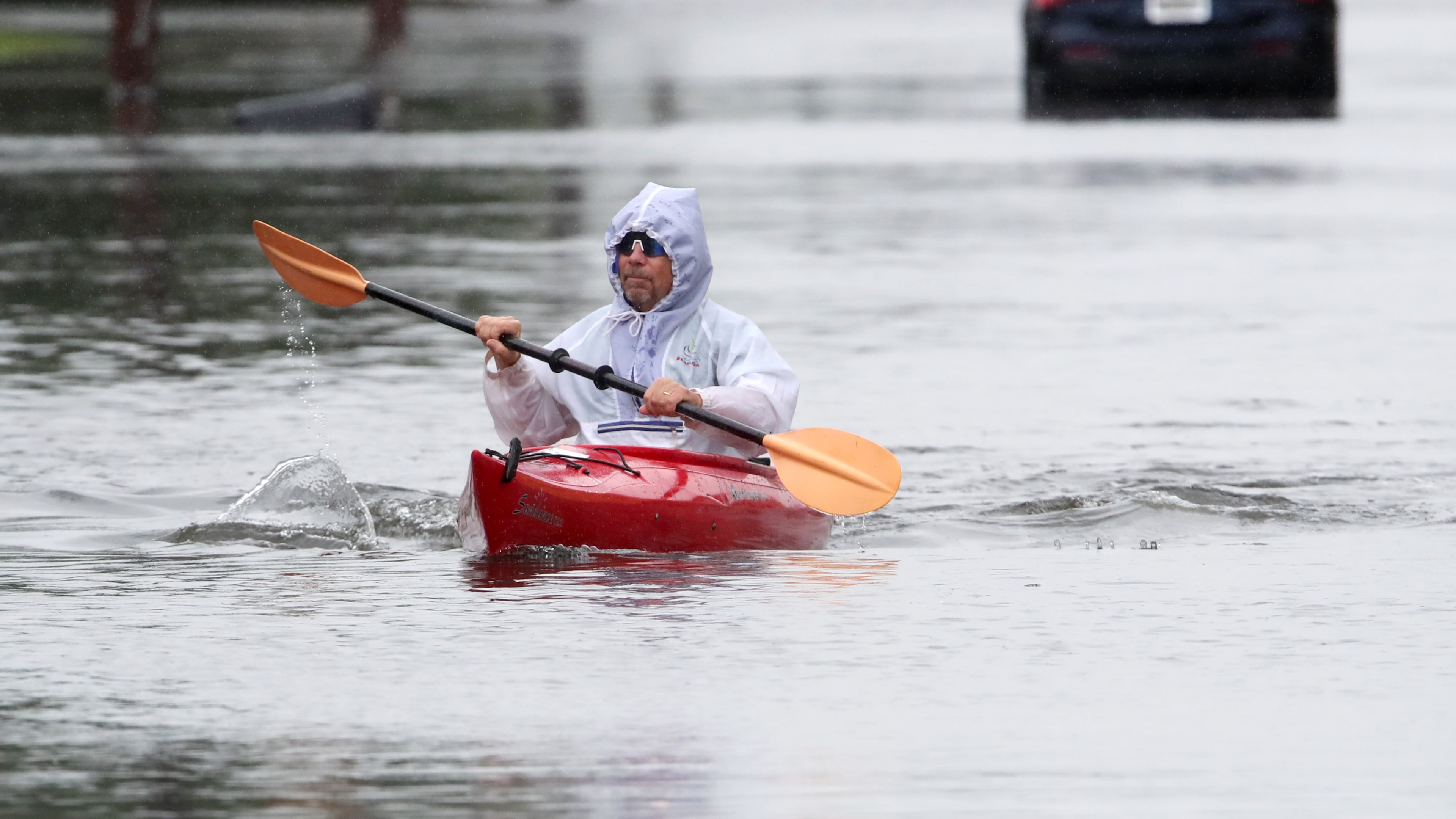 Ted Friedli kayaks his way through a flooded section of Florence Ave. during a nor'easter in Long Branch, N.J., Saturday, Sept. 26, 2026 (AP Photo/Noah K. Murray)