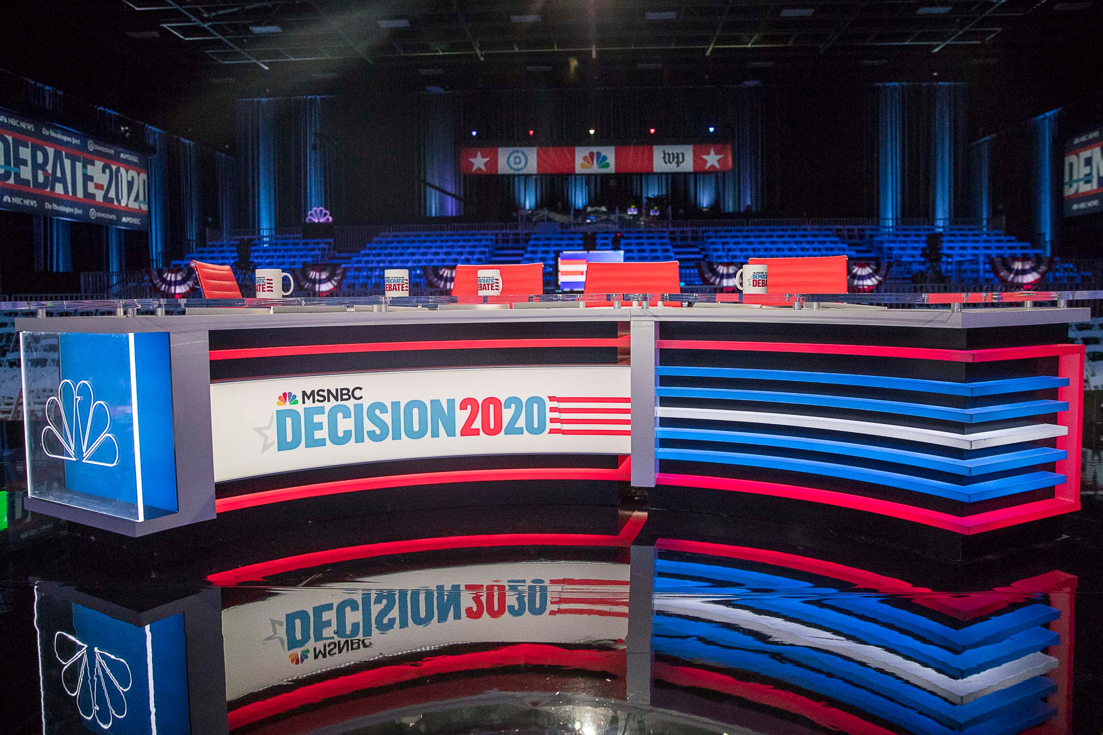 11/19/2019 -- Atlanta, Georgia -- A table for the debate moderators is set up as crews continue to work on the final touches of the debate stage a day before the televised MSNBC/The Washington Post Democratic Presidential debate inside the Oprah Winfrey Soundstage at Tyler Perry Studios in Atlanta, Tuesday, November 19, 2019. (Alyssa Pointer/Atlanta Journal Constitution)