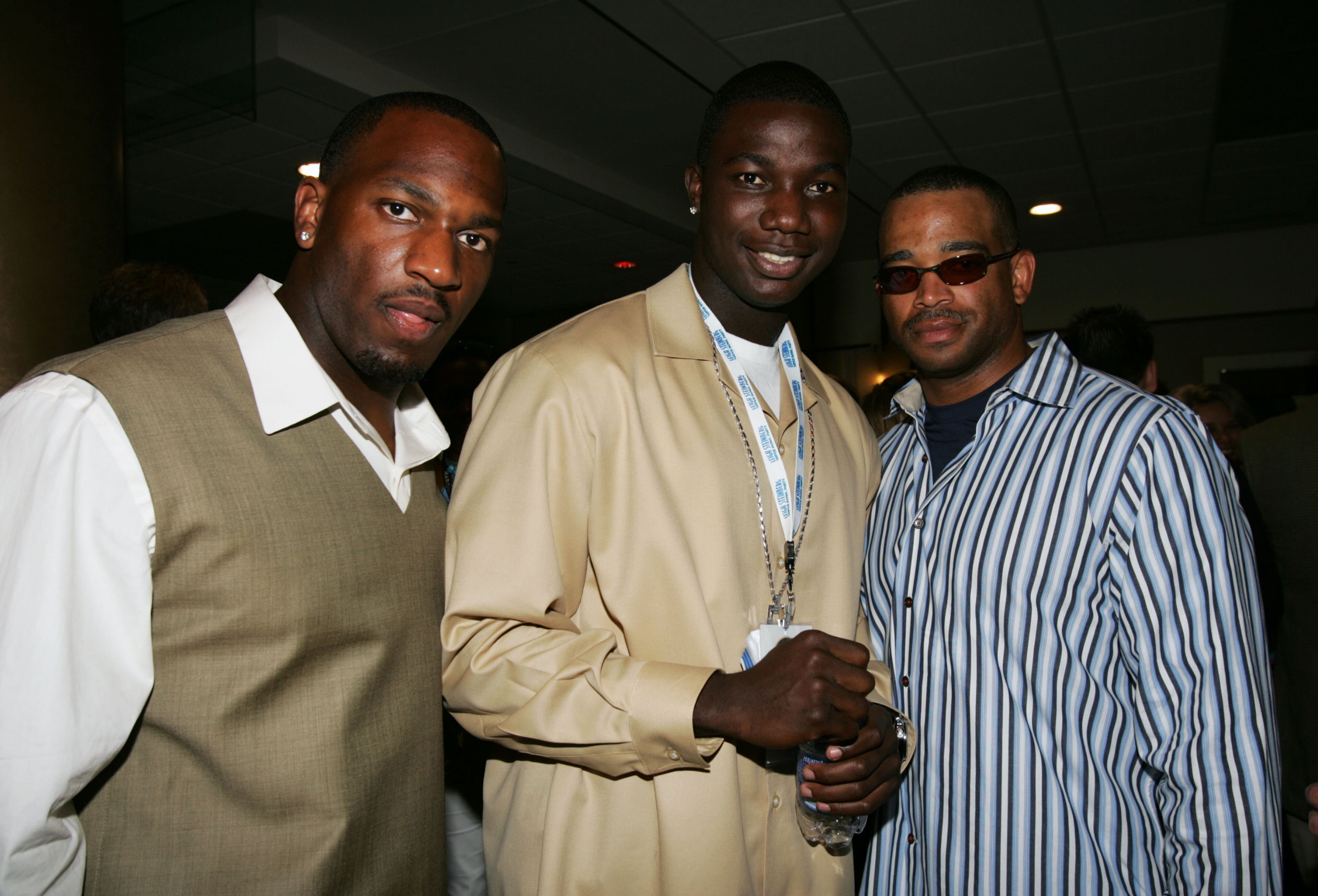 JACKSONVILLE, FL - FEBRUARY 05: (L to R) College linebacker Kirk Morrison, college quarterback Adrian McPherson and ESPN Sportscenter host, Stuart Scott pose for a photo during the Leigh Steinberg Annual Super Bowl Event on February 5, 2005 at Times Union Center in Jacksonville, Florida. (Photo by Frank Micelotta/Getty Images)