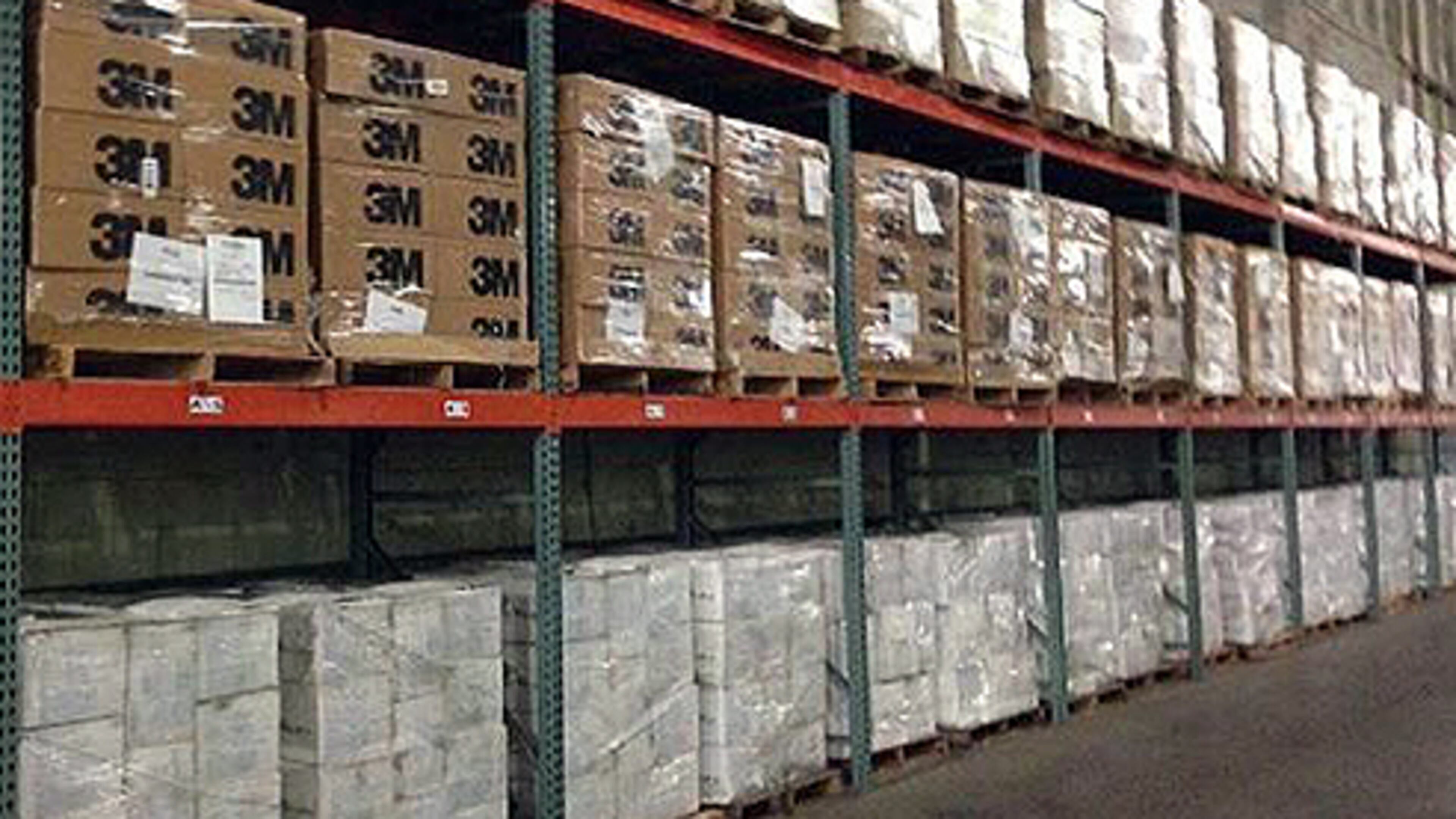 Image downloaded from the inspector general's audit shows an aisle from the Department of Homeland Security's stockpile of nitrile gloves, surgical masks, respirators and coverall suits.