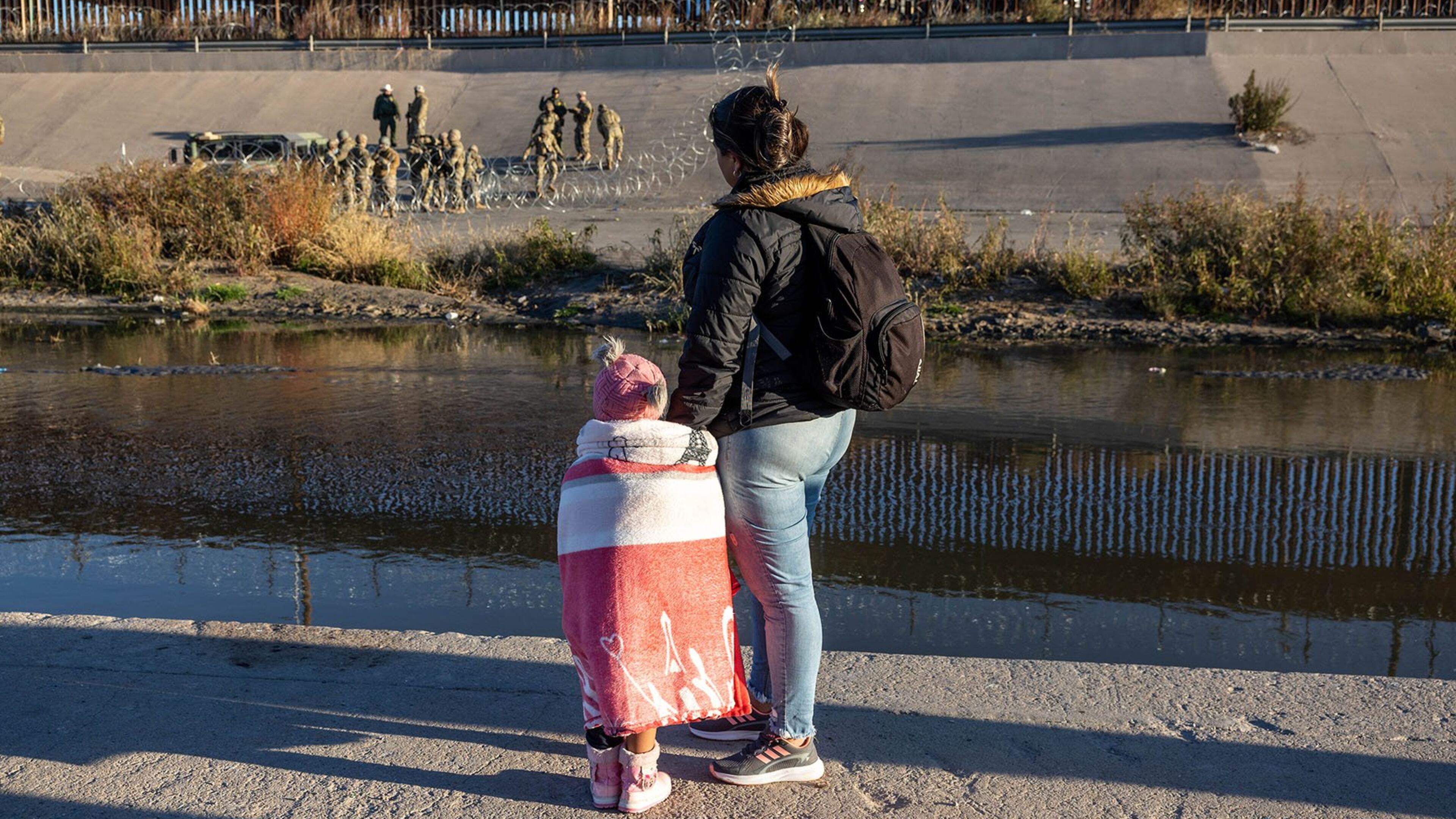 Texas National Guard troops stop migrants from entering a popular crossing area along the bank of the Rio Grande in El Paso, Texas, in 2022. (JOHN MOORE/GETTY IMAGES)