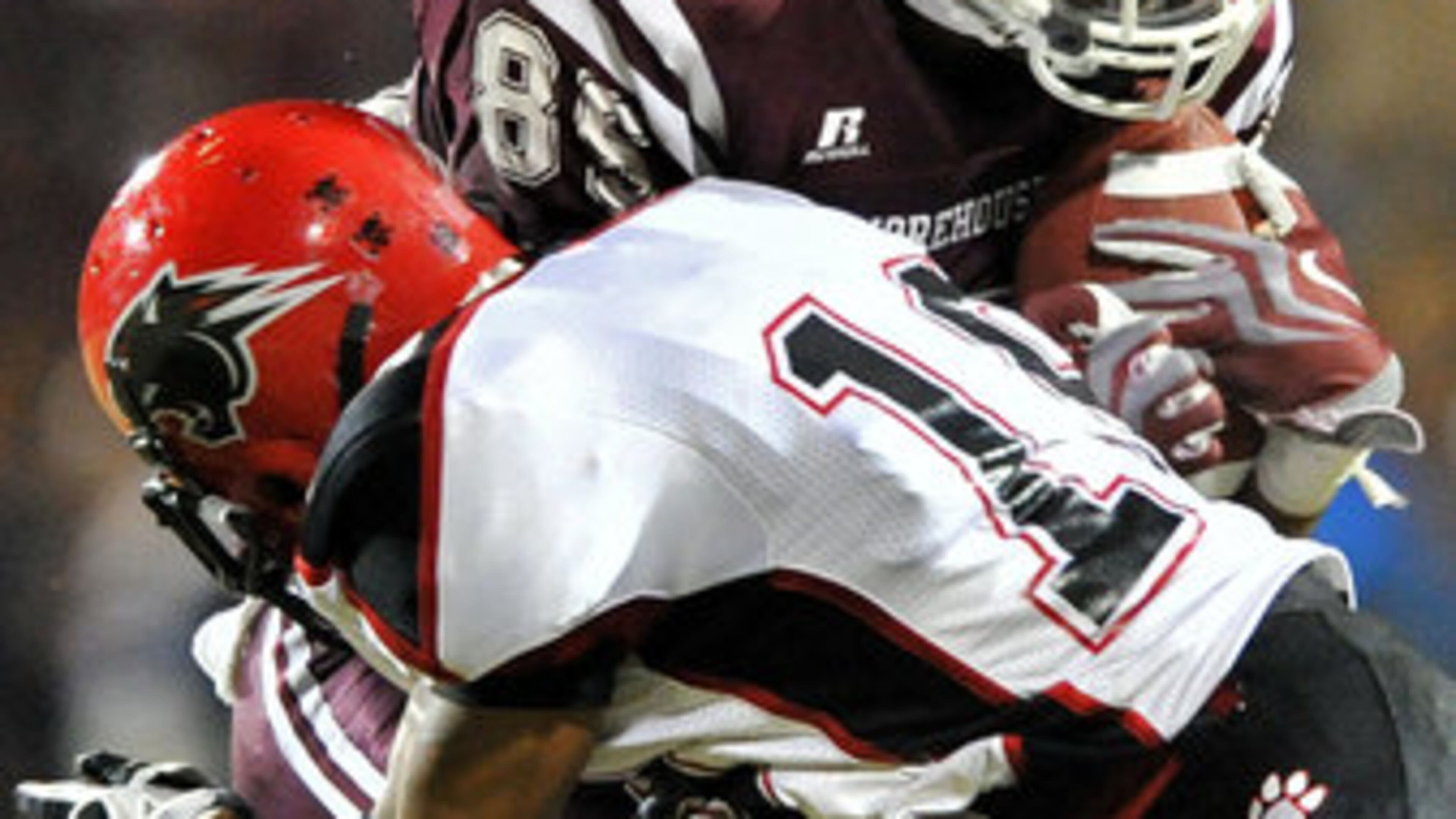 Morehouse Derrick Hector (85) gets hit by Clark Atlanta Brandon Wilkerson (19) after he made a catch in the first half at B.T. Harvey Stadium in Morehouse College in this 2011 file photo.