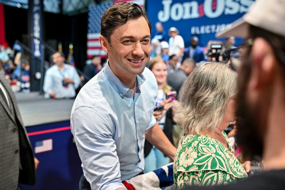 U.S. Sen. Jon Ossoff shakes hands with a constituent during a rally in Savannah in June. (Sarah Peacock for the AJC)