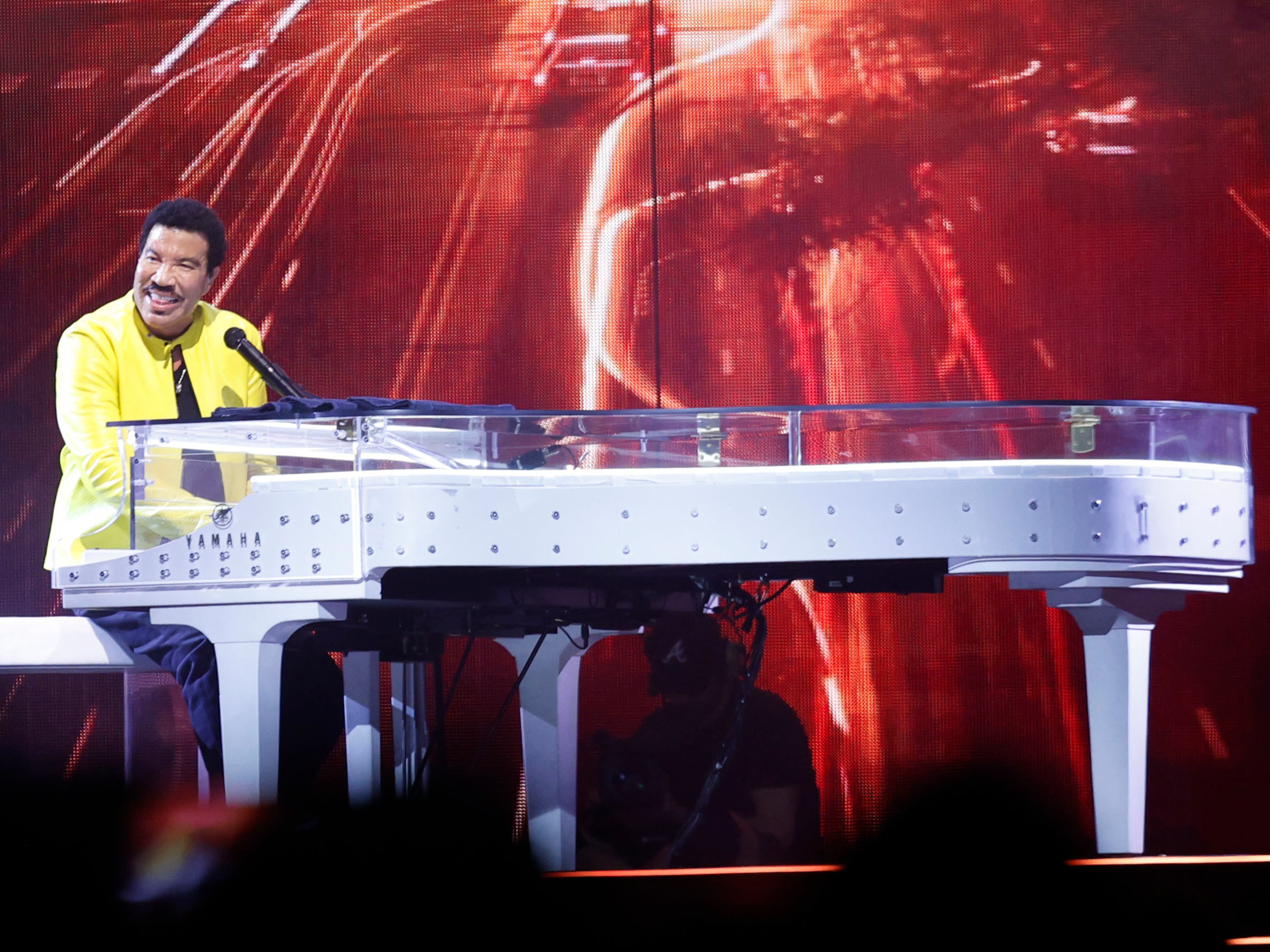 Lionel Richie performs at the piano Sunday, July 19, 2026, at State Farm Arena. (Akili-Casundria Ramsess for the AJC)