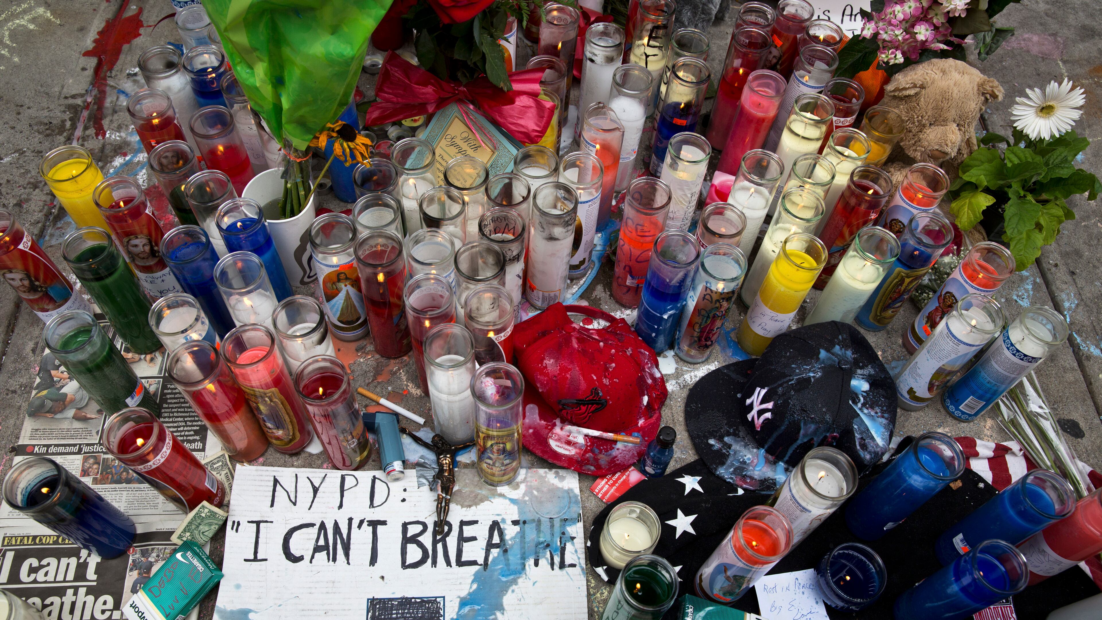 FILE — A memorial for Eric Garner, on the spot in Staten Island where he died after a police officer used a chokehold to subdue him, in New York, July 19, 2014. A grand jury has reportedly declined to indict that officer, Daniel Pantaleo, a decision which city officials fear will only fuel protests already underway related to the Michael Brown case in Ferguson, Mo. (Todd Heisler/The New York Times) A memorial where Eric Garner was subdued by police. (New York Times photo/Todd Heisler)