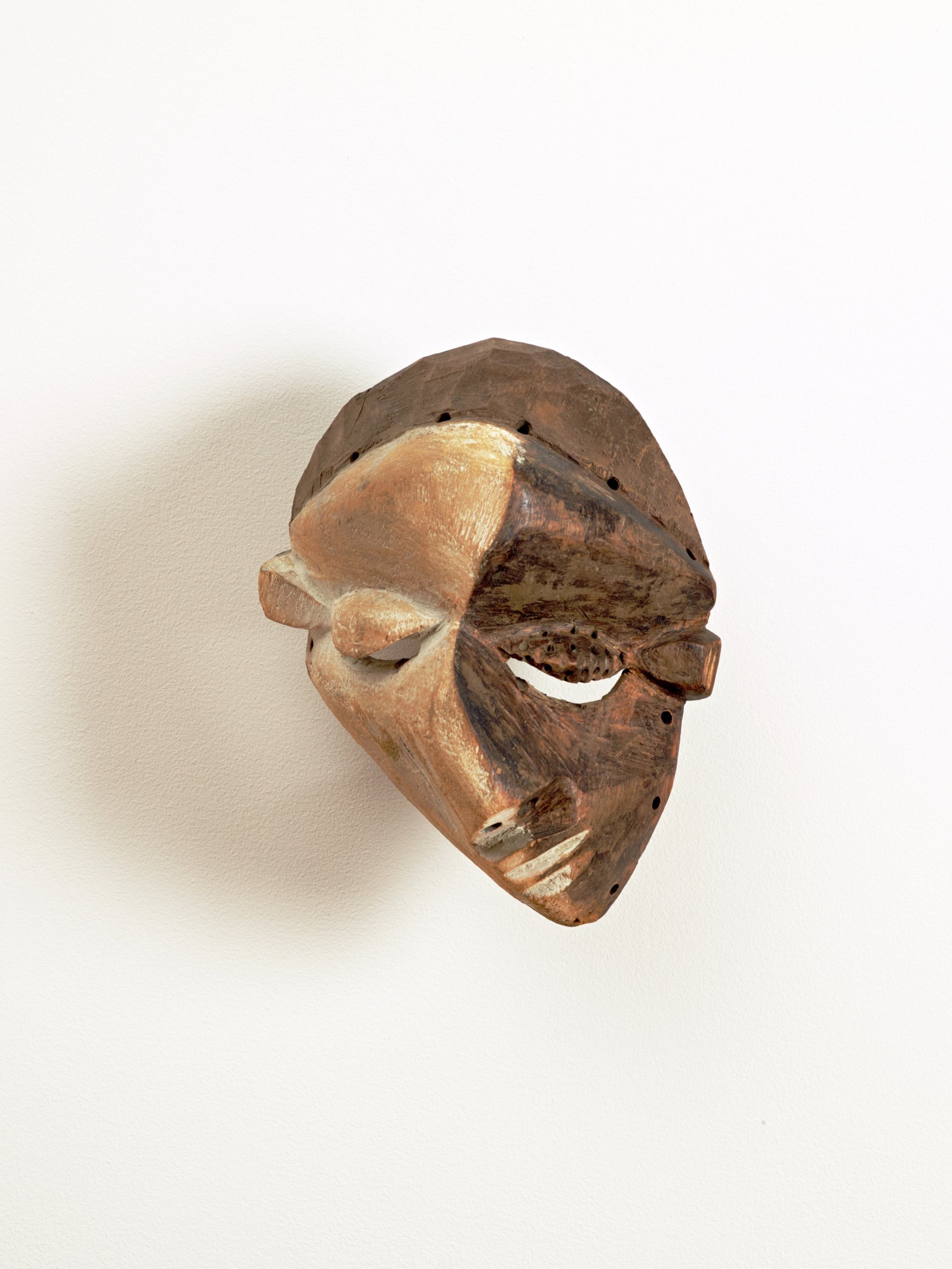 Democratic Republic of the Congo, mask, made by an unknown artist in the early 20th century of wood and kaolin pigment
Baeza says of this mask:
"Masquerading enjoyed an extraordinary resurgence in the Central Pende region in the early twentieth century, in part because so many other routes to male prestige had been blocked. In the 1930s, during the Pende rebellion, masquerade performance constituted a form of resistance to Belgian colonial rule. Pende masquerade performance remains vital to this day. Masks with black and-and-white faces are called masques de maladie, or sickness masks. These masks represent people whose faces are permanently disfigured by illness in order to promote compassion for these individuals."