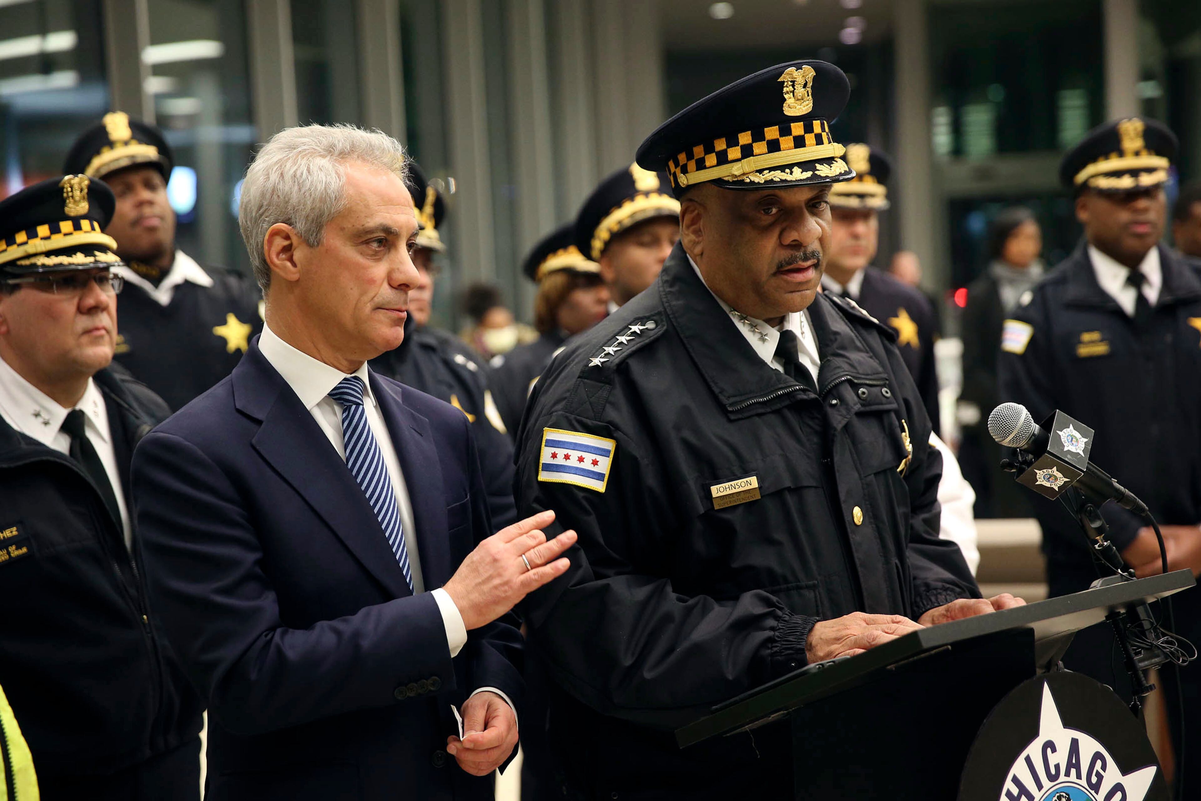 Chicago Mayor Rahm Emanuel, left, comforts Chicago Police Superintendent Eddie Johnson, Monday, Nov. 19, 2018, during a news conference at the University of Chicago Medical Center, in Chicago, after a gunman opened fire at Mercy Hospital, killing a police officer and two hospital employees. (Chris Walker/Chicago Tribune via AP)