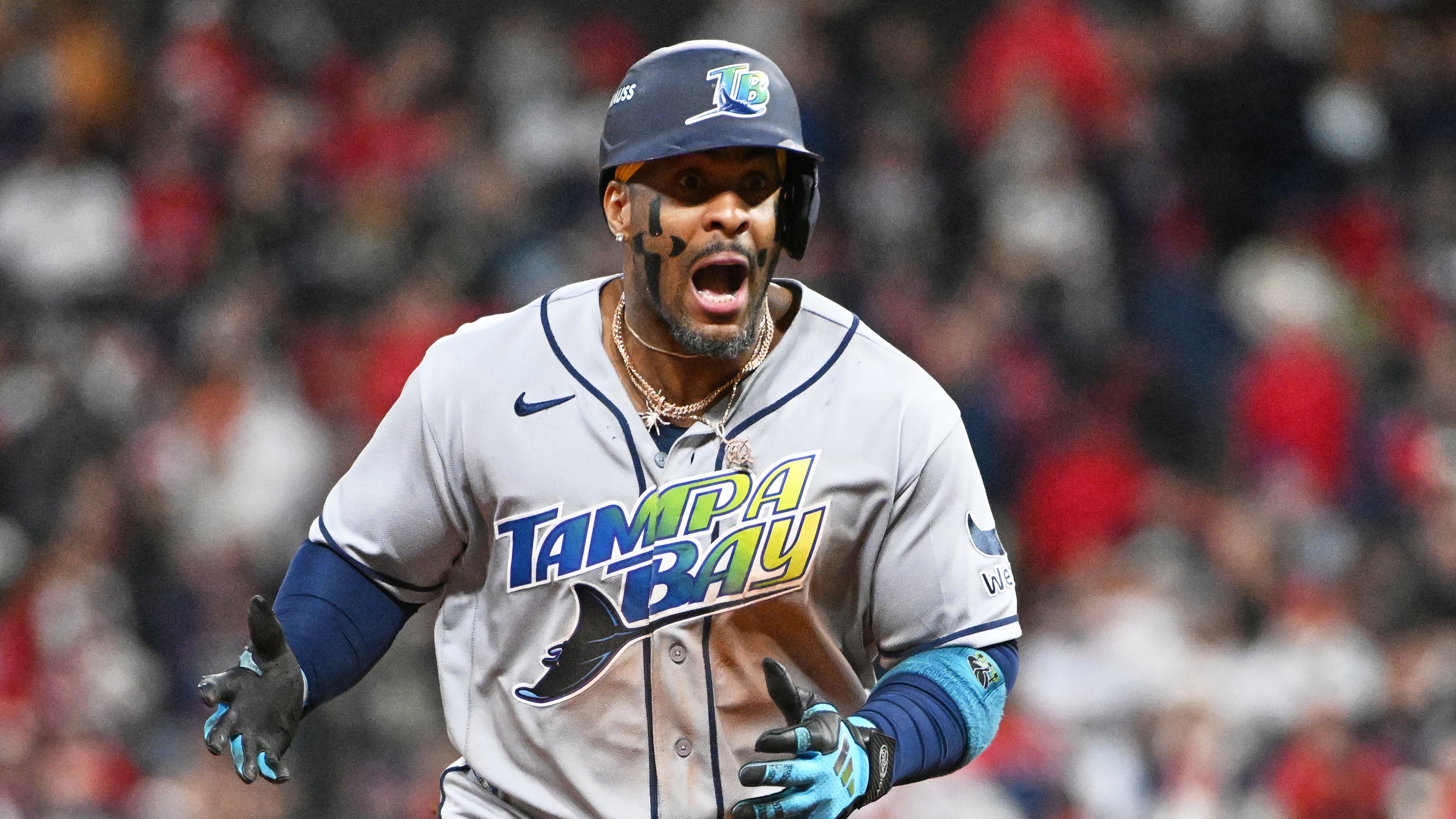 Tampa Bay Rays' Yandy Díaz celebrates a two-run home run against the Cleveland Guardians during the ninth inning in Game 4 of an American League Championship Series baseball game in Cleveland, Saturday, Oct. 17, 2026. (AP Photo/Phil Long)