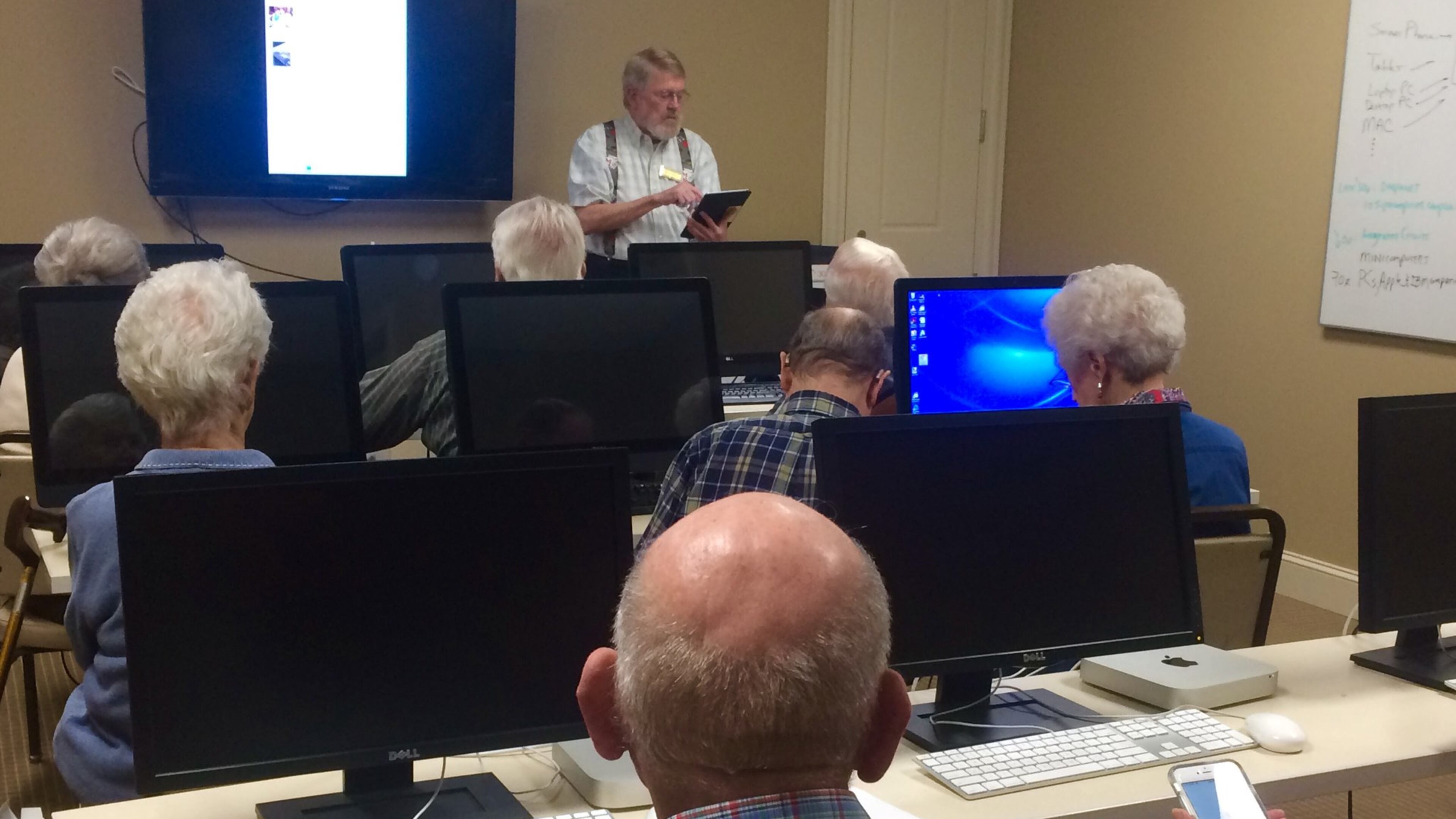 A capacity crowd filled the computer room at Lenbrook Senior Living community in January for Jim Cochrane's class on using smart phones, tablets and other personal technology effectively. Photo by Jill Vejnoska/jvejnoska@ajc.com