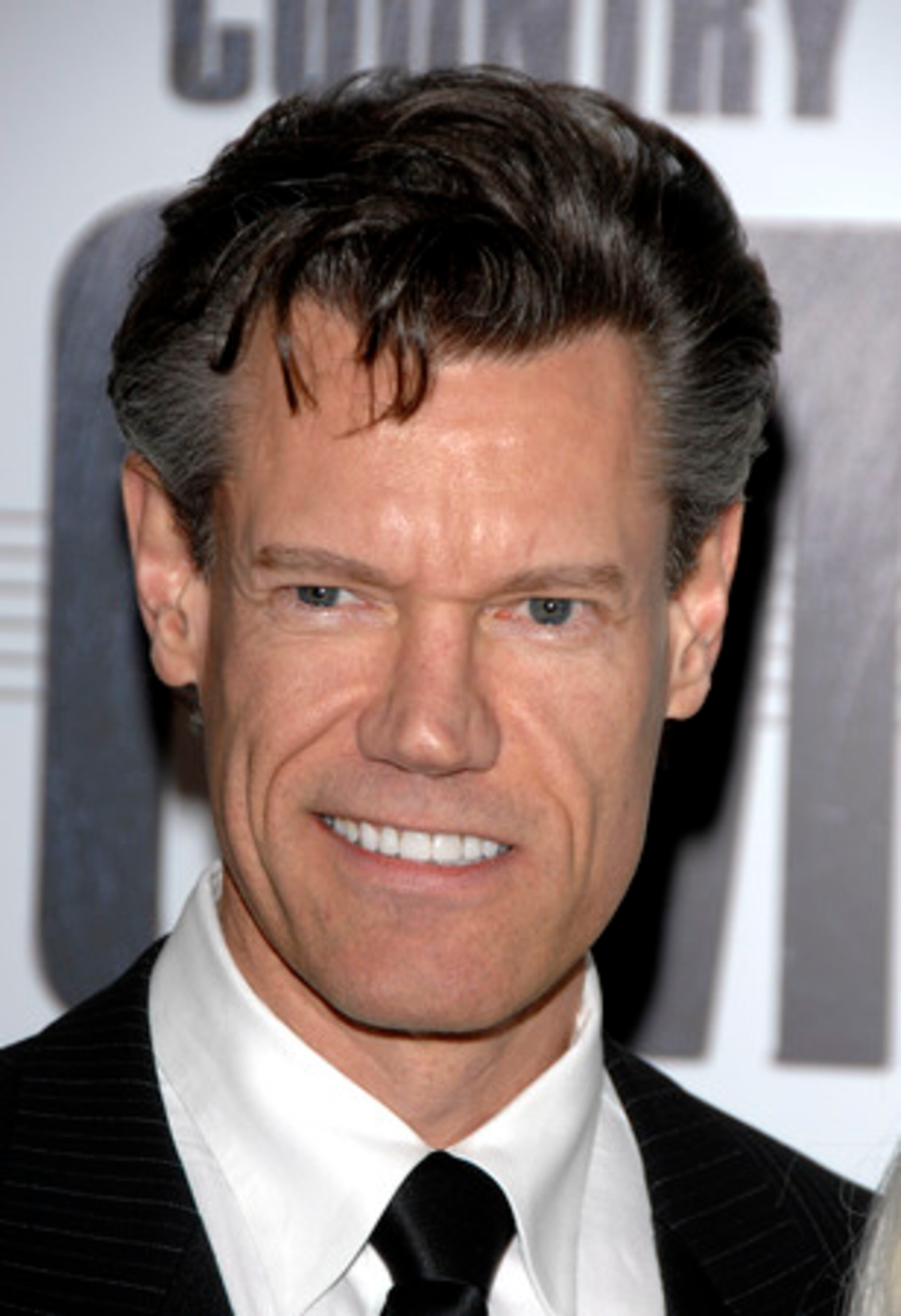 Get ready to top off your tux with a Stetson and blend your bling with boots -- tonight Nashville plays host to the 41st annual Country Music Association Awards. Singer Randy Travis is among the first to arrive at the event.