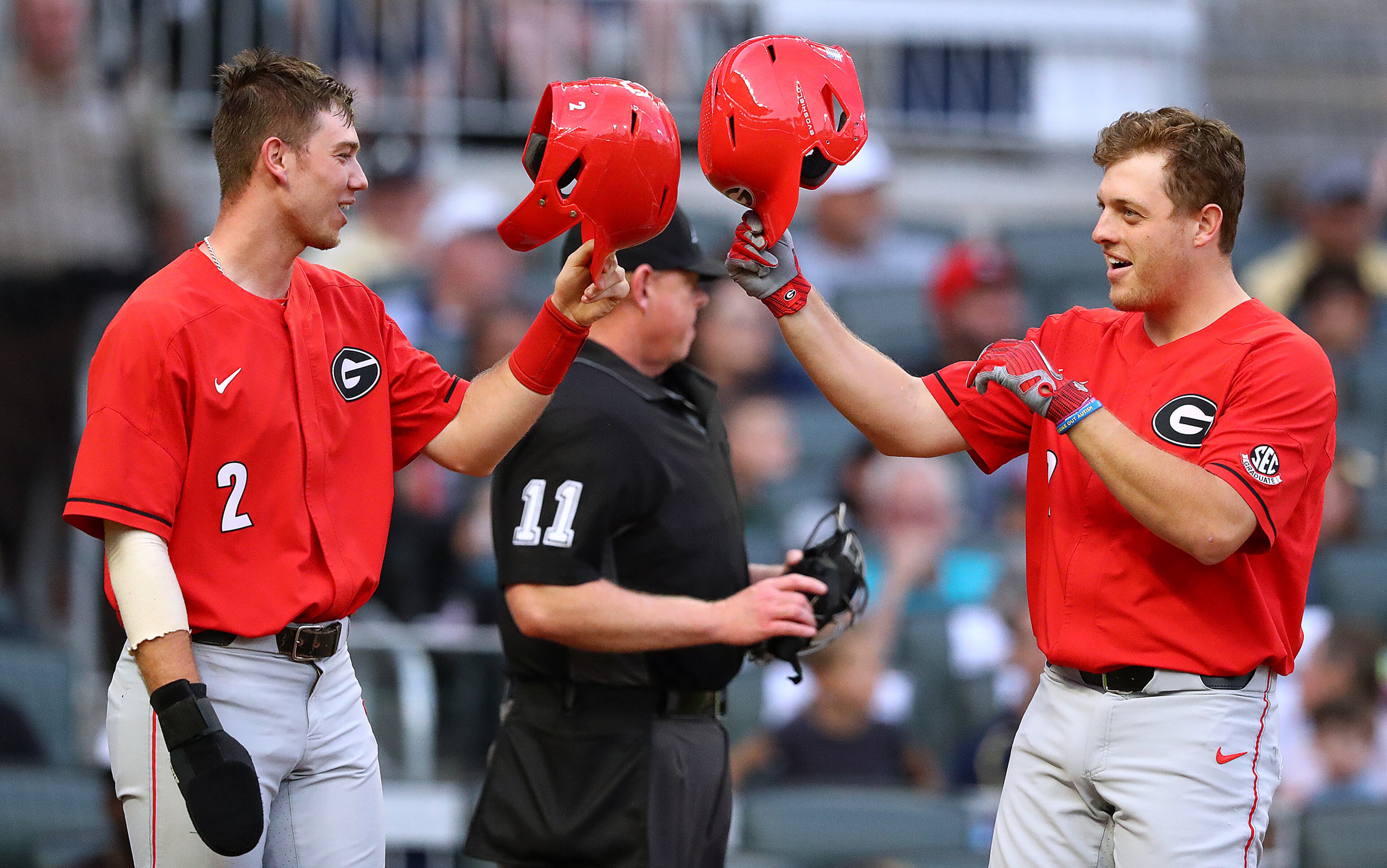 April 23, 2019 Atlanta: Georgia designated hitter John Cable (right) gets a helmet bump from L.J. Talley at home as he hits a 2-RBI home run to take a 2-1 lead over Georgia Tech during the second inning in the Spring Classic NCAA college baseball game at SunTrust Park on Tuesday, April 23, 2019, in Atlanta. Curtis Compton/ccompton@ajc.com