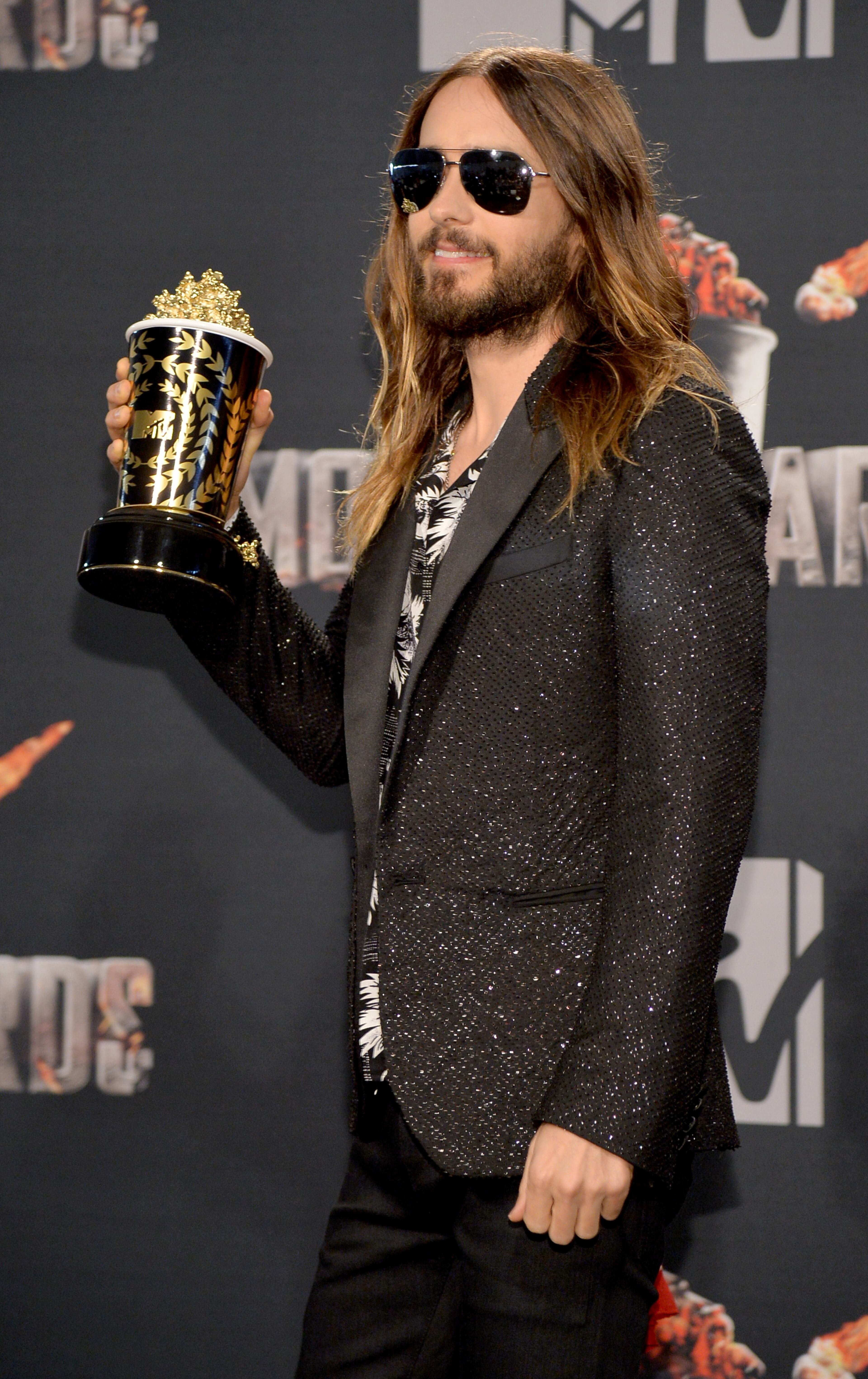 LOS ANGELES, CA - APRIL 13: Actor Jared Leto poses with the Best On-Screen Transformation award in the press room during the 2014 MTV Movie Awards at Nokia Theatre L.A. Live on April 13, 2014 in Los Angeles, California. (Photo by Michael Buckner/Getty Images)