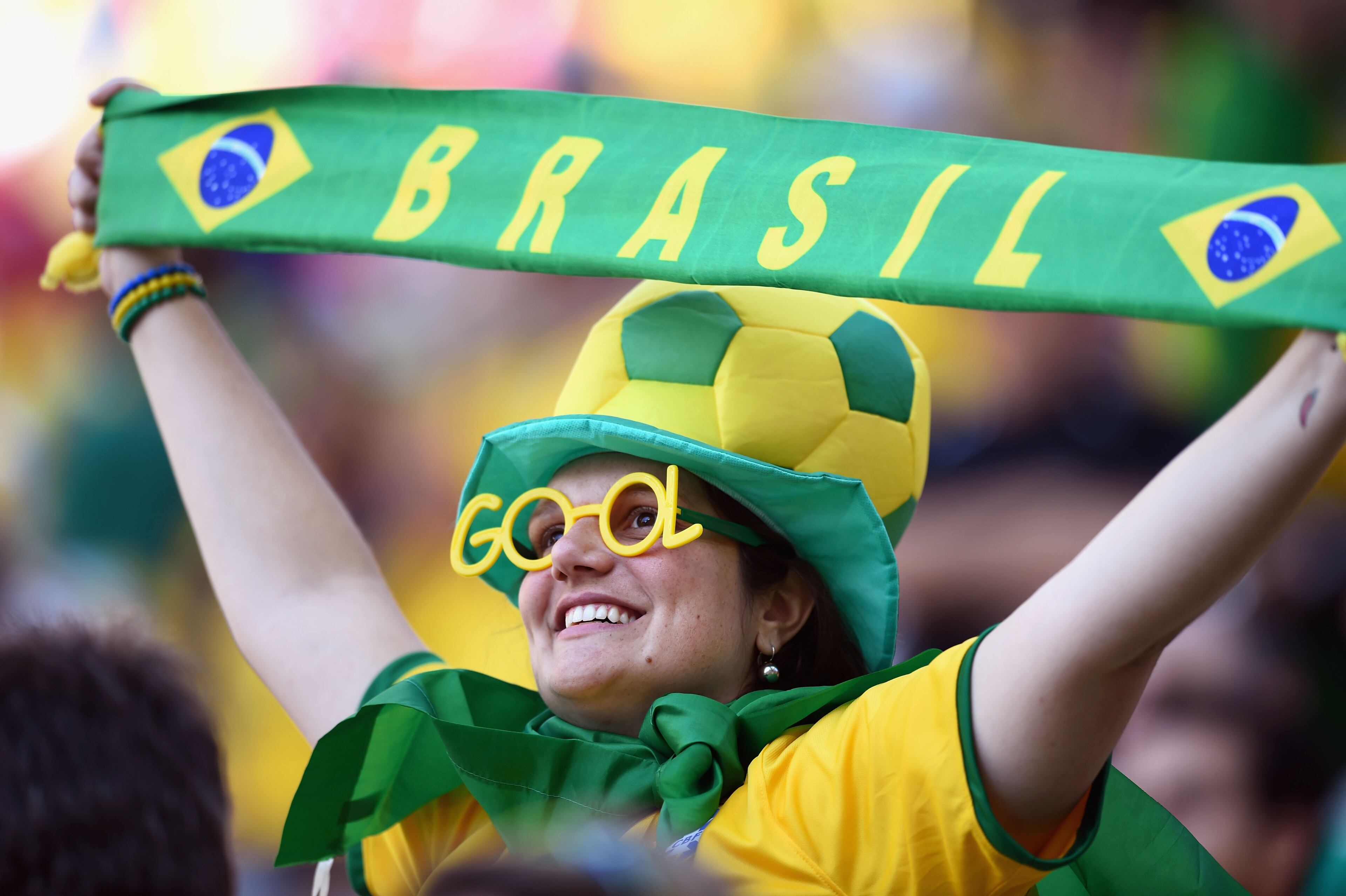 SAO PAULO, BRAZIL - JUNE 12: A Brazil fan holds a scarf before the Opening Ceremony of the 2014 FIFA World Cup Brazil prior to the Group A match between Brazil and Croatia at Arena de Sao Paulo on June 12, 2014 in Sao Paulo, Brazil. (Photo by Christopher Lee/Getty Images)