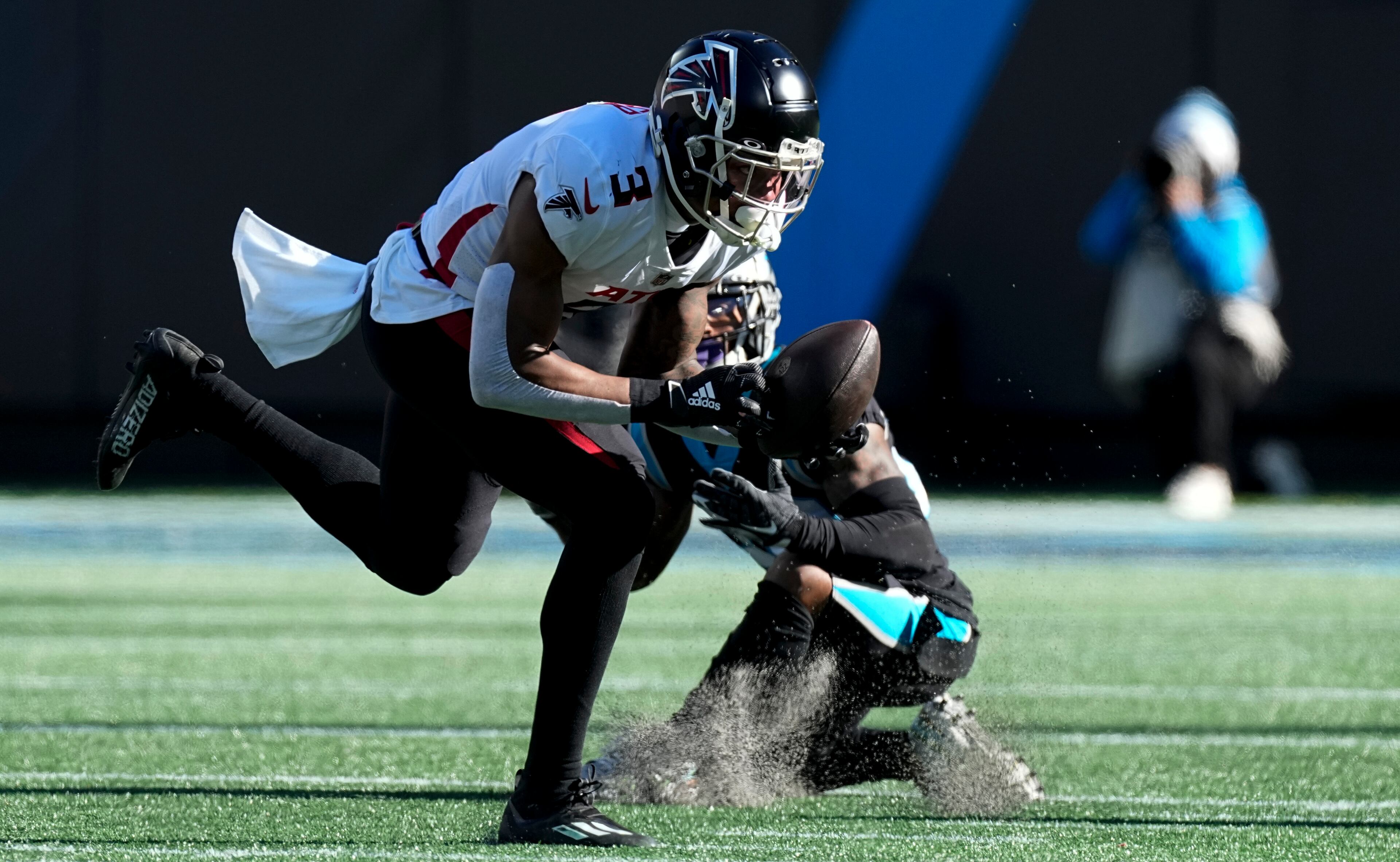 Falcons linebacker Mykal Walker intercepts a pass intended for Carolina Panthers running back Ameer Abdullah during the first half of Sunday's game in Charlotte.