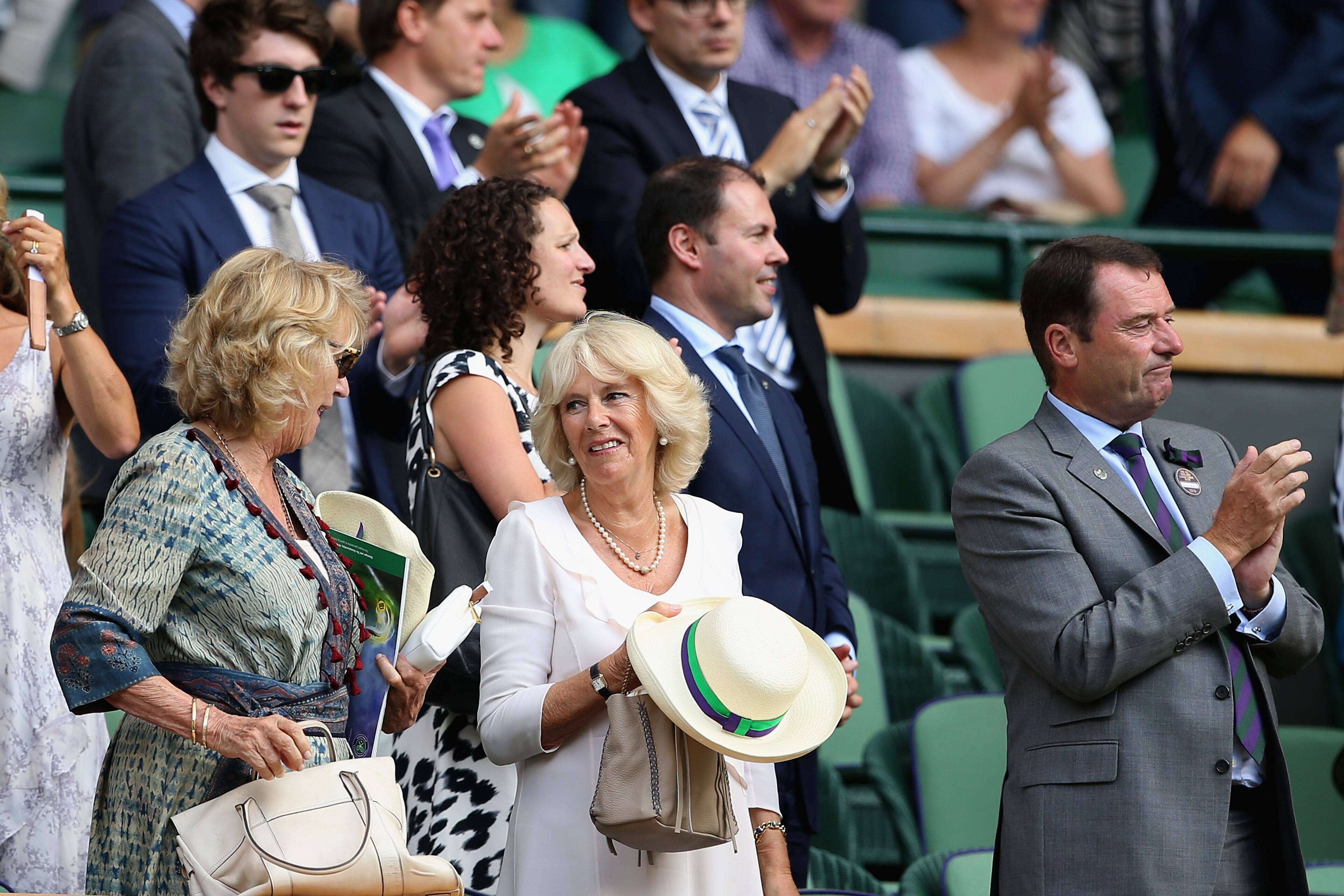 LONDON, ENGLAND - JULY 02: Camilla, Duchess of Cornwall (C) and AELTC Chairman Phiip Brook (R) take their seat on Centre Court during day four of the Wimbledon Lawn Tennis Championships at the All England Lawn Tennis and Croquet Club on July 2, 2015 in London, England. (Photo by Ian Walton/Getty Images)