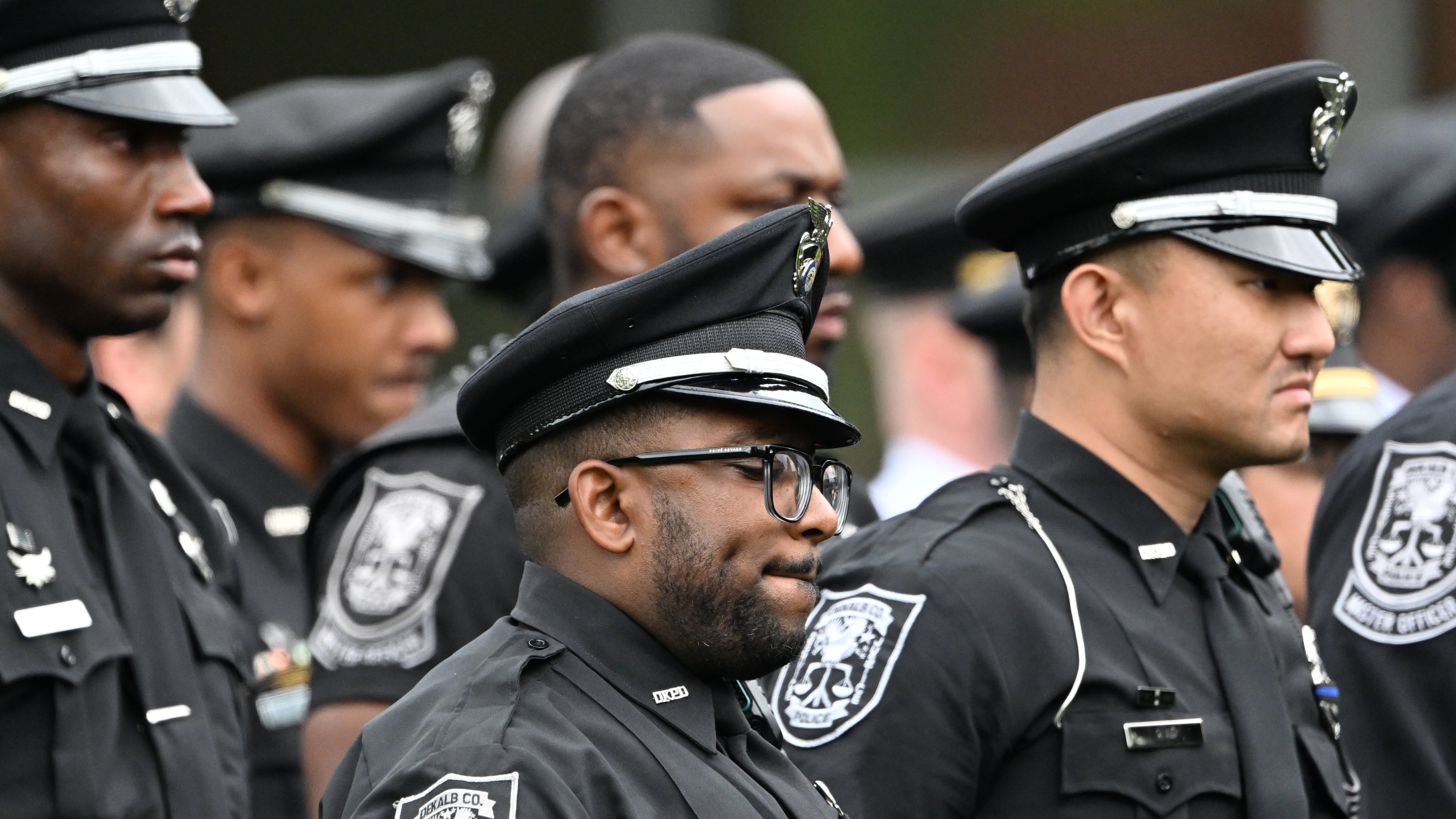DeKalb County officers attend at a memorial service for officer David Rose, who was killed while responding to the Aug. 8, 2025, shooting at the Centers for Disease Control and Prevention. (Hyosub Shin/AJC 2025)