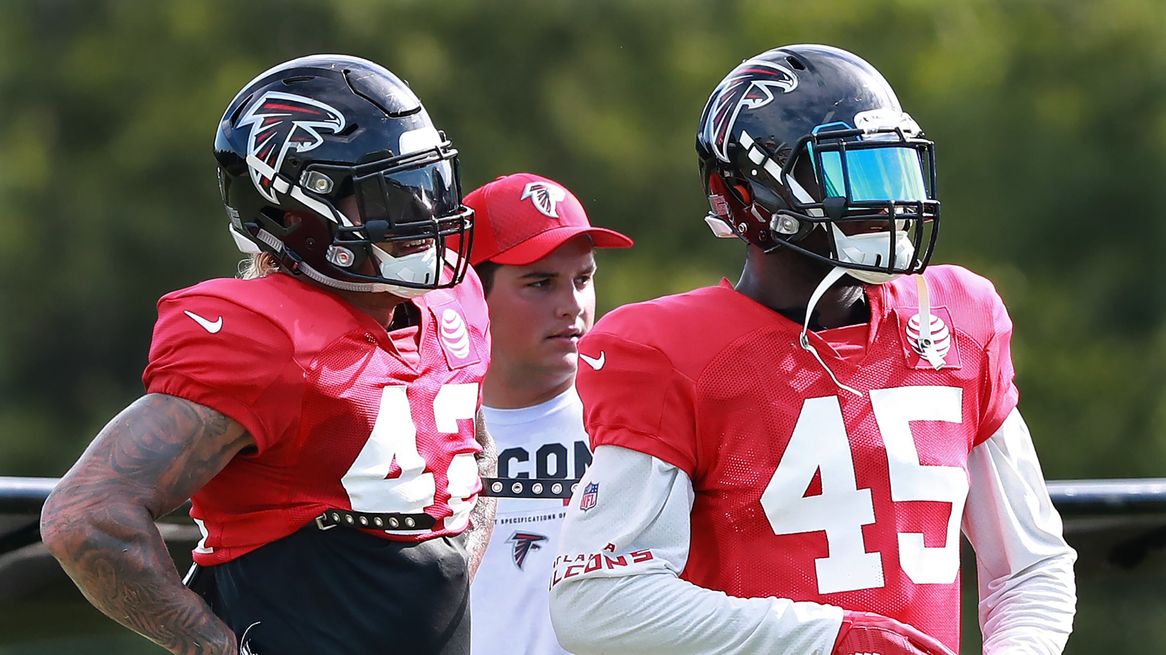 August 7, 2018 Flowery Branch: Atlanta Falcons linebackers Duke Riley (left) and Deion Jones watch from the sidelines between defensive series at NFL football training camp practice on Tuesday, August 7, 2018, in Flowery Branch. Curtis Compton/ccompton@ajc.com