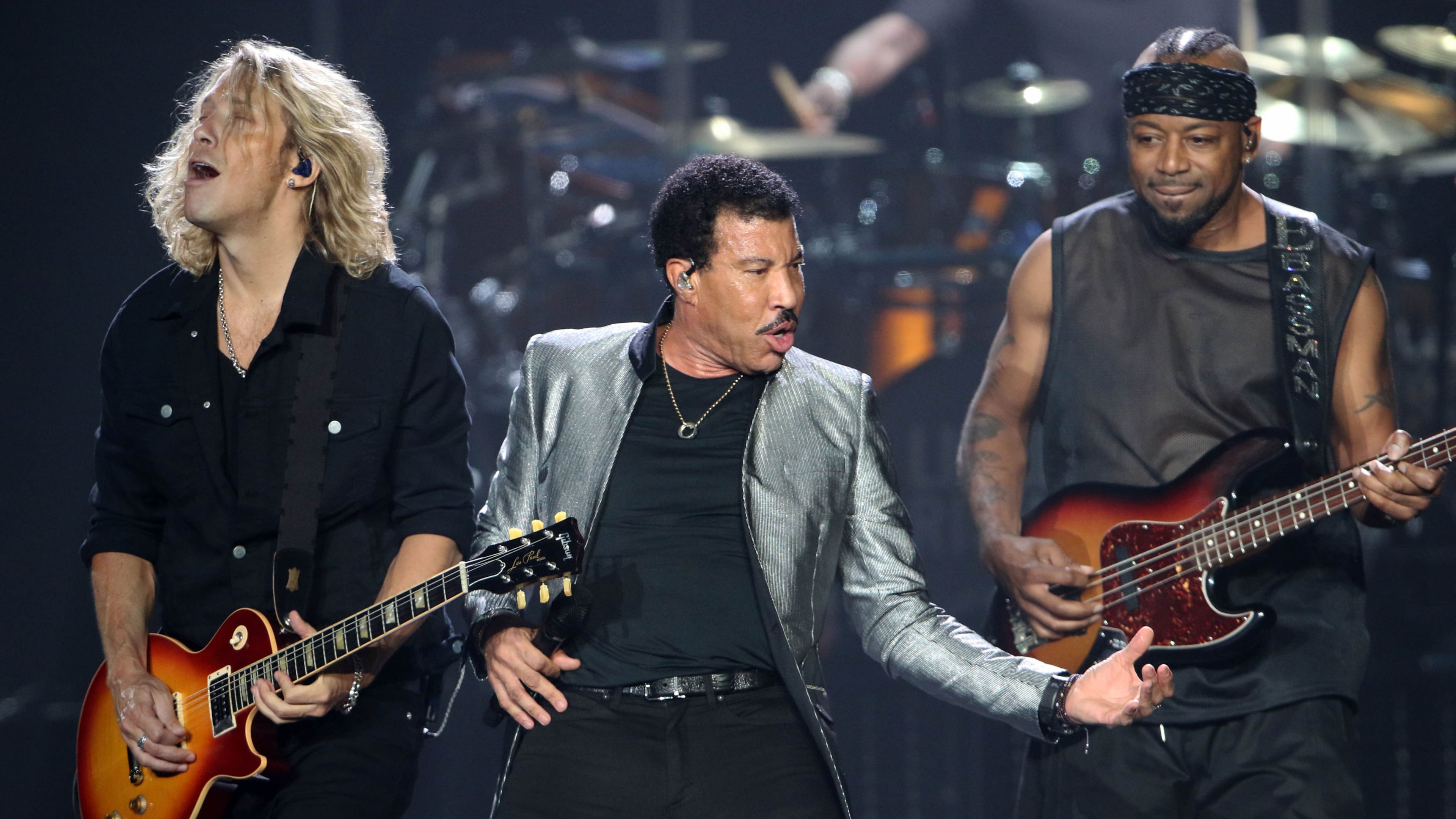Lionel Richie, along with guitarist Ben Mauro and bassist Ethan Farmer, put some zip into "Running With the Night." Photo: Photo: Robb Cohen Photography & Video /RobbsPhotos.com