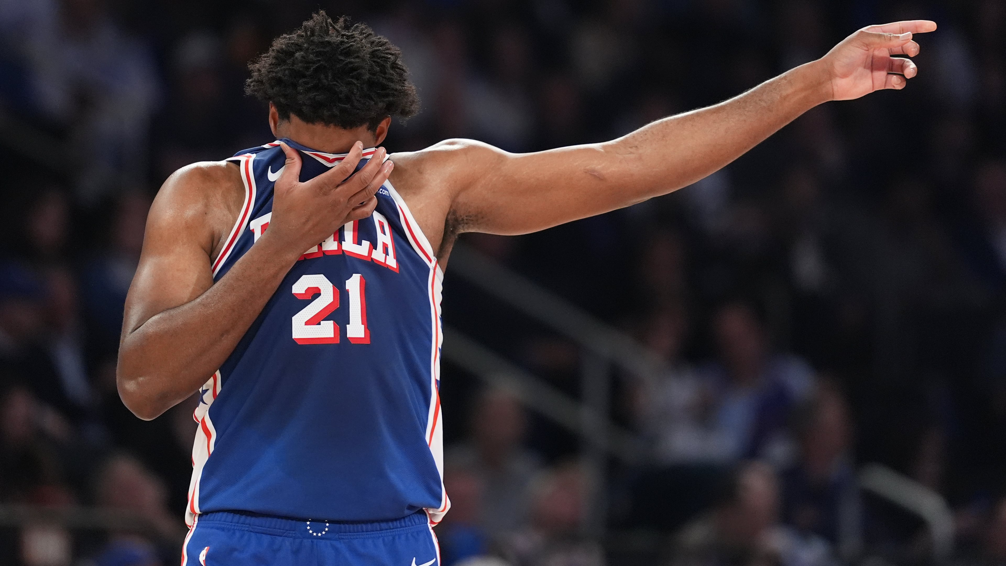 Philadelphia 76ers' Joel Embiid reacts during the first half of Game 1 in a second-round NBA basketball playoffs series against the New York Knicks Monday, May 4, 2026, in New York. (AP Photo/Seth Wenig)