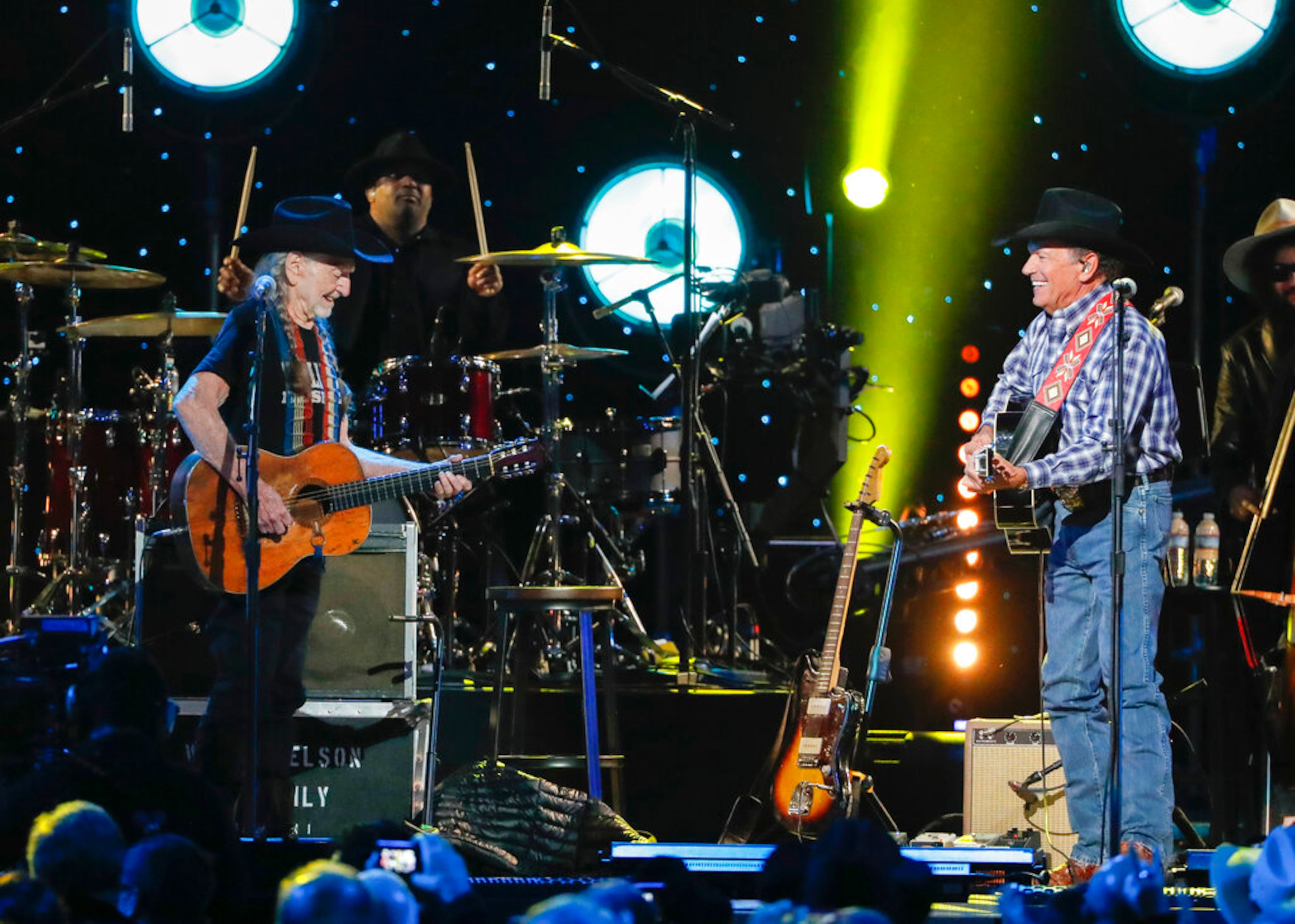 Willie Nelson, left, and George Strait perform at Willie: Life & Songs Of An American Outlaw at Bridgestone Arena on Saturday, Jan. 12, 2019, in Nashville, Tenn. (Photo by Al Wagner/Invision/AP)
