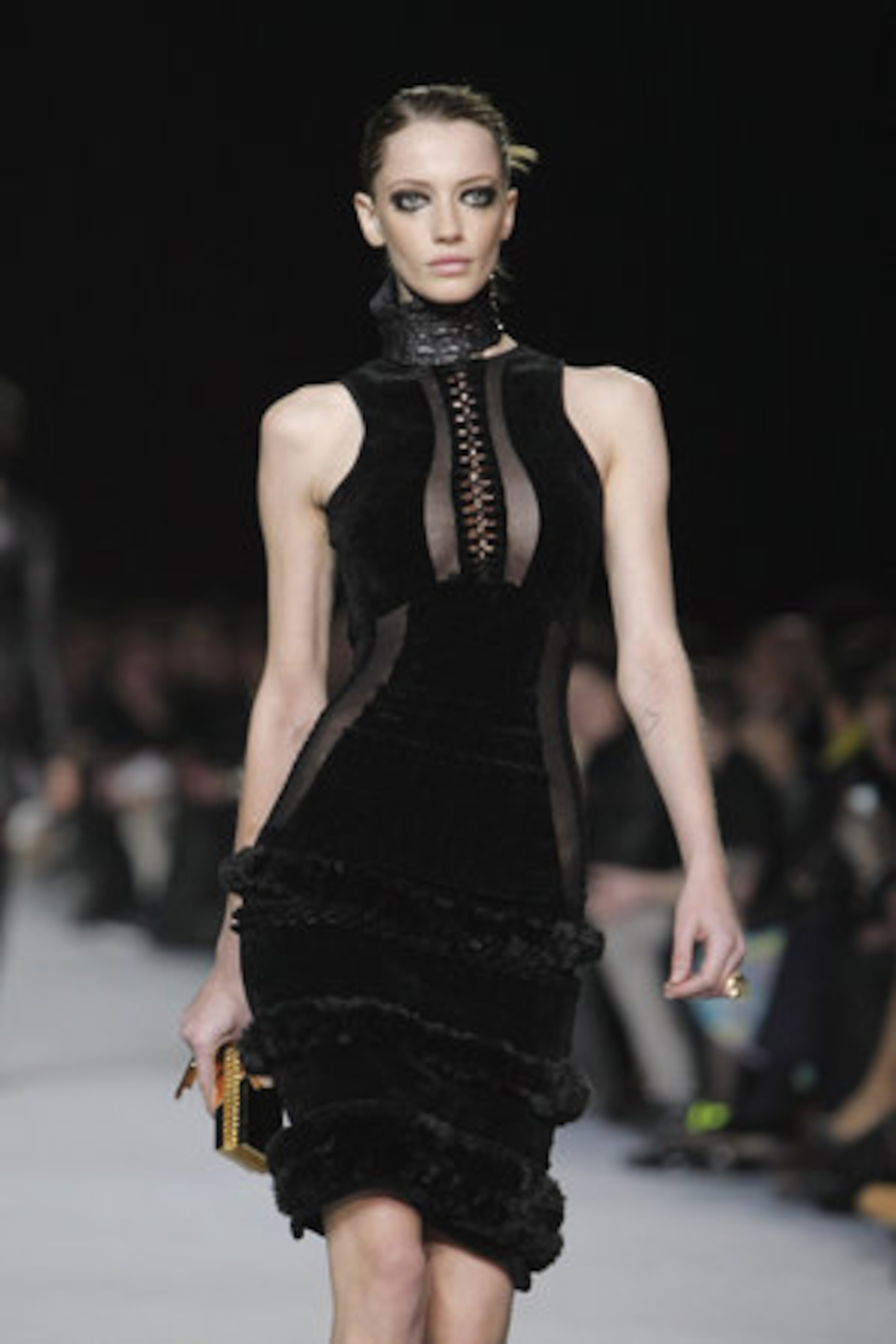 A model displays a slinky black dress, part of Kanye West's fashion collection.