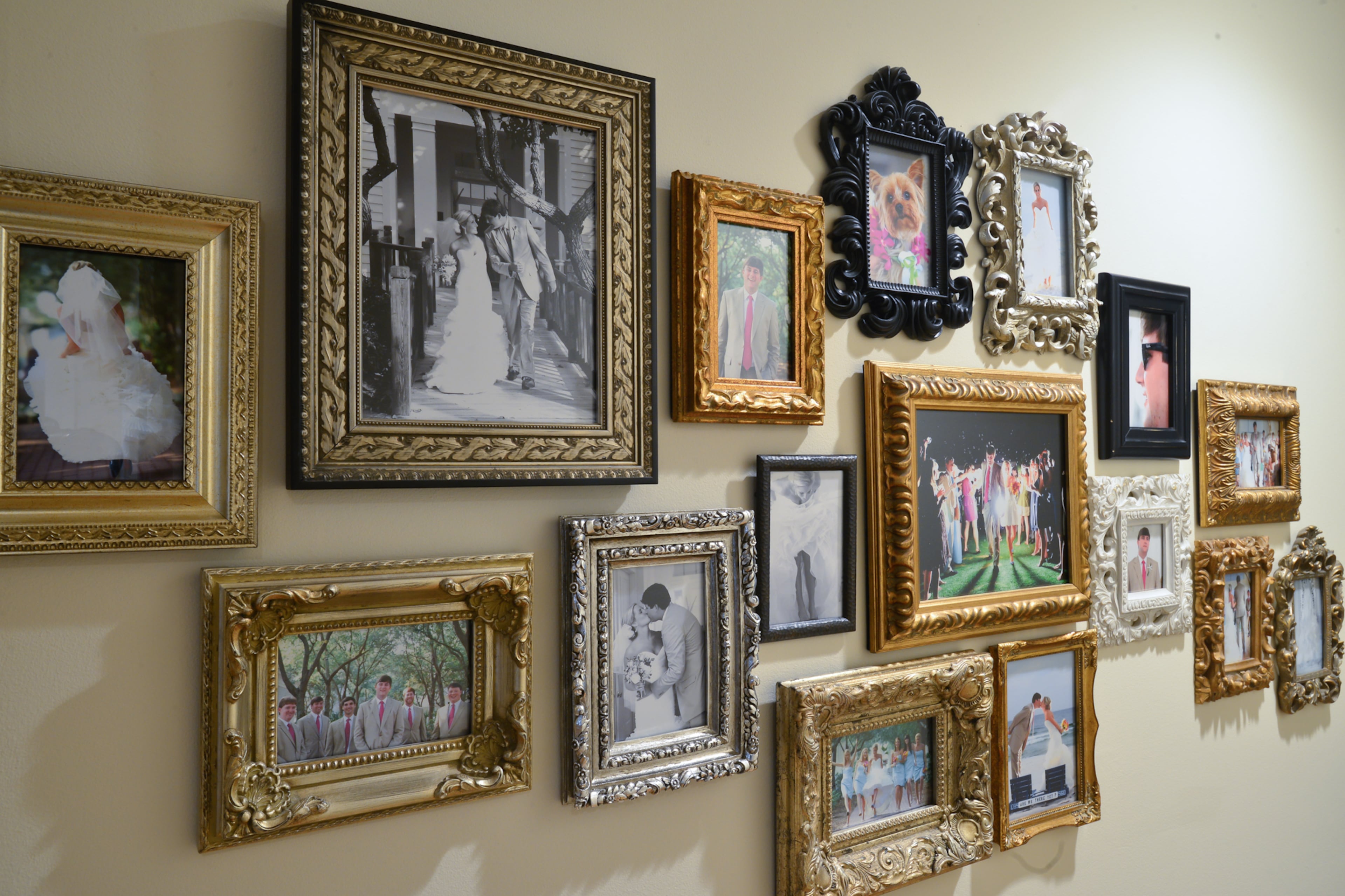 Wedding photos are grouped together for a collage wall in Justin and Betsy Clay's home.