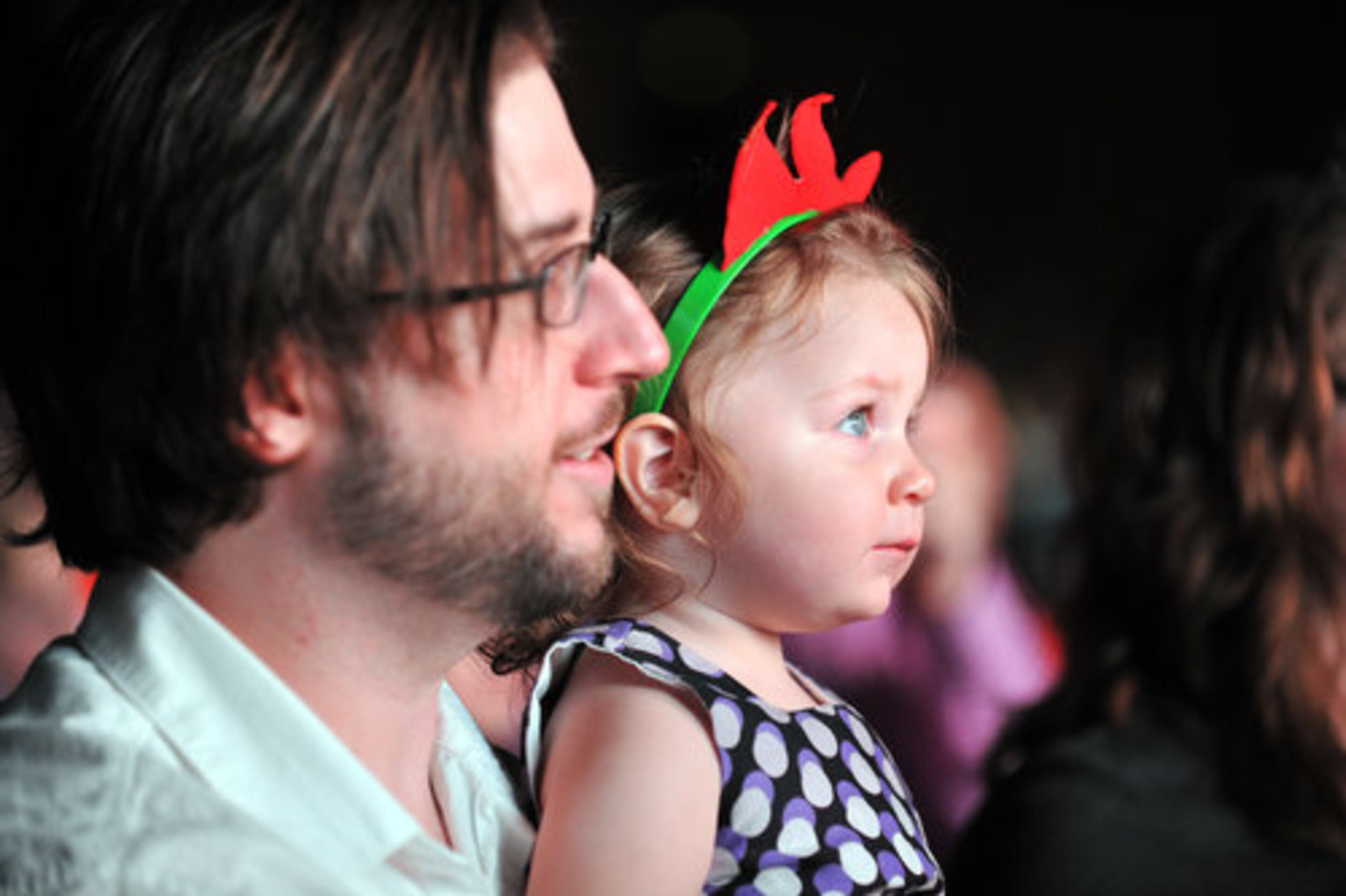 Steven Cook and his 2-year-old daughter Callie watch DJ Lance Rock and the Gabba Gang.