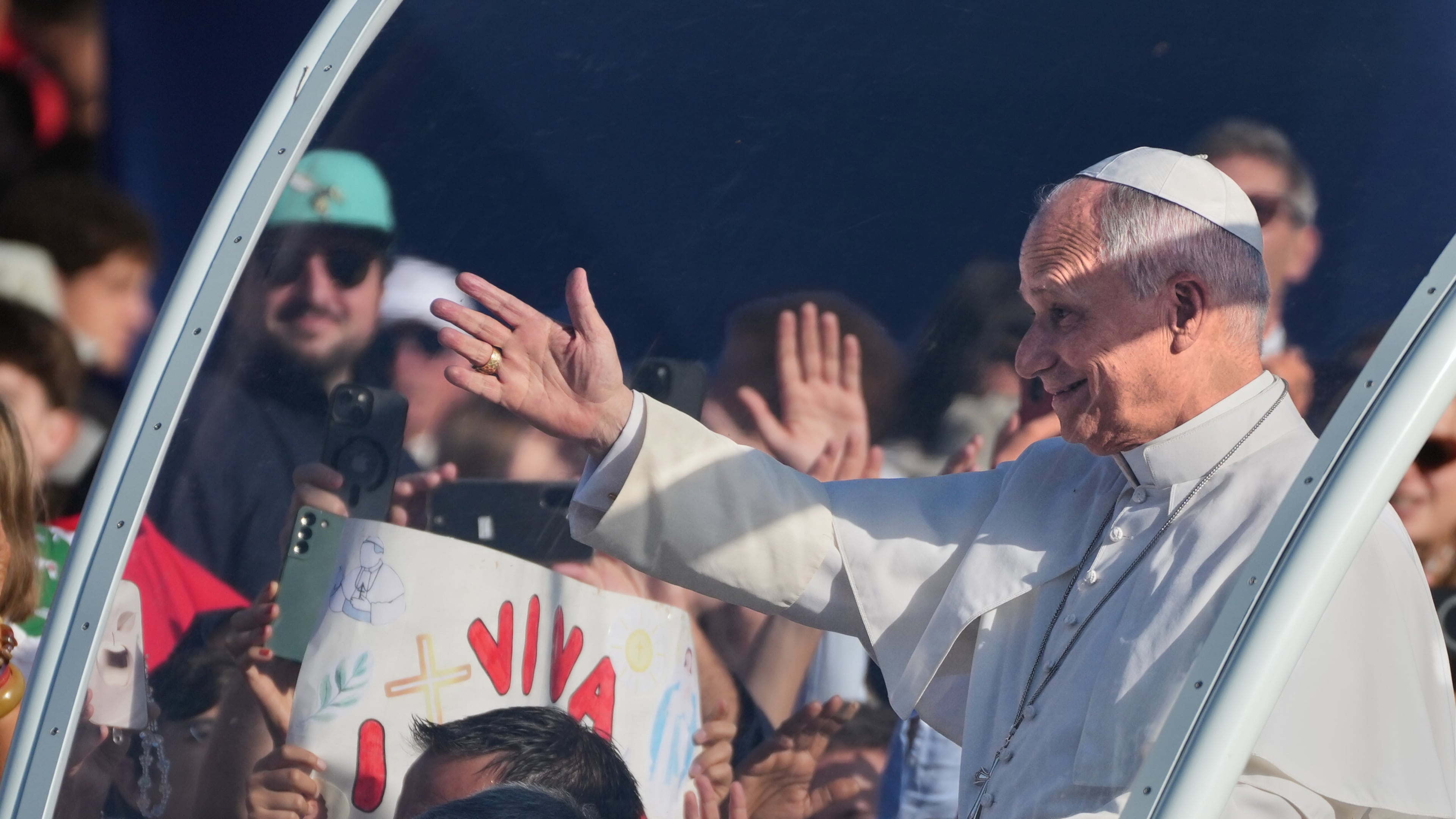 Pope Leo XIV arrives on the popemobile to celebrate Mass at the Sanctuary of Our Lady of Lourdes, Sunday, Sept. 27, 2026, in Lourdes, France. (AP Photo/Gregorio Borgia)