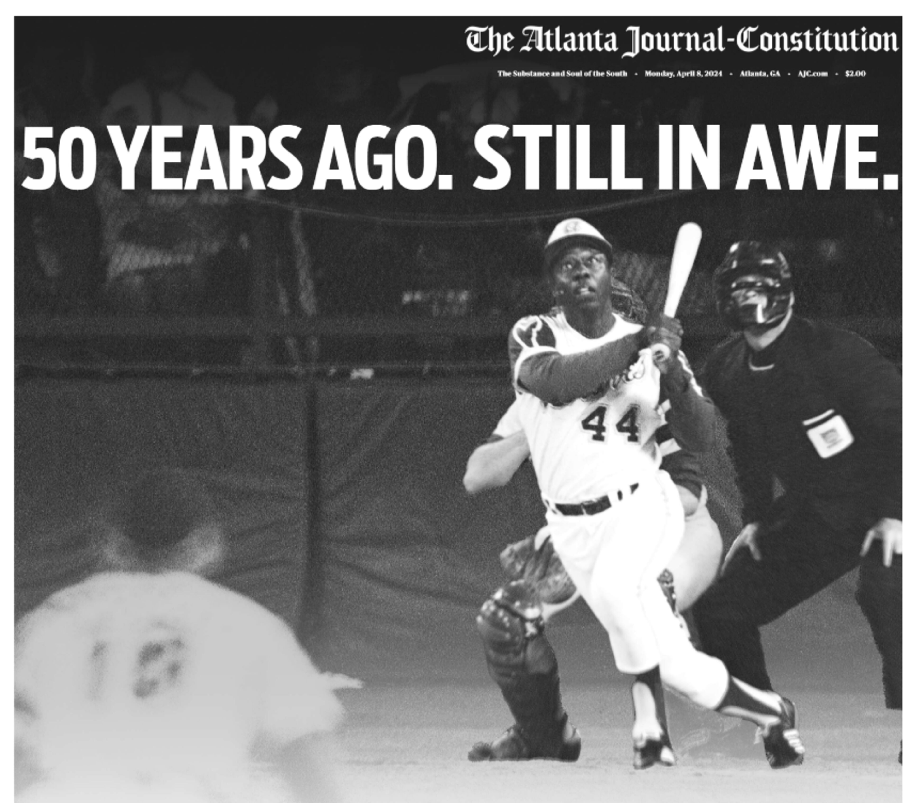 The Monday, April 8, 2024, print edition of The Atlanta Journal-Constitution features a poster that wraps around the front page, marking the 50th anniversary of Hank Aaron's historic home run.