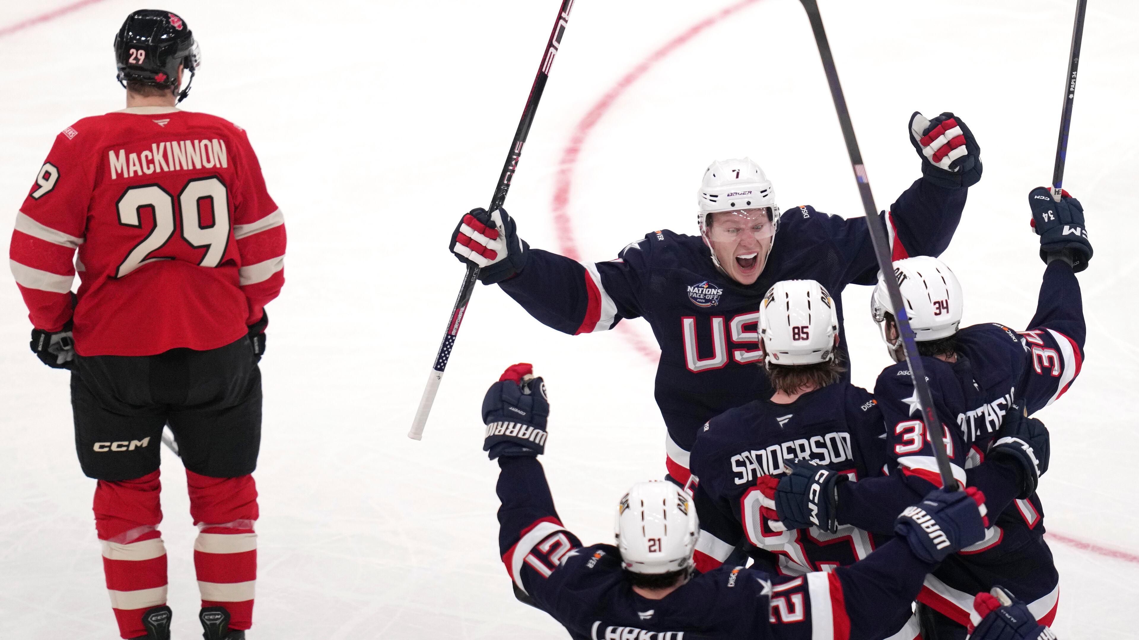 FILE - United States' Jake Sanderson (85) is congratulated after his goal against Canada during the second period of the 4 Nations Face-Off championship hockey game, Thursday, Feb. 20, 2025, in Boston. (AP Photo/Charles Krupa, file)
