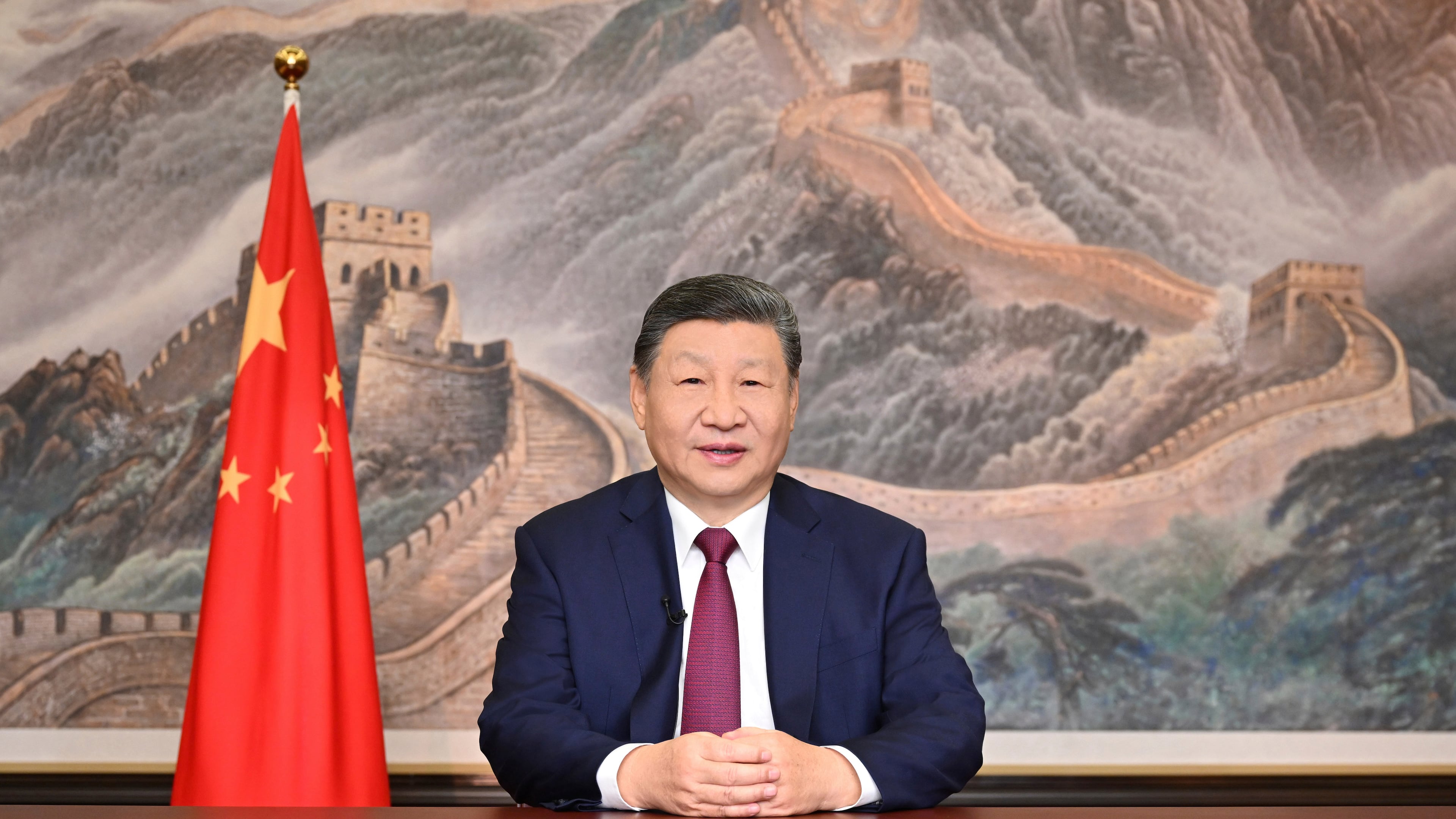 In this photo released by Xinhua News Agency, Chinese President Xi Jinping delivers his 2026 New Year message in Beijing on Wednesday, Dec. 31, 2025. (Yan Yan/Xinhua via AP)