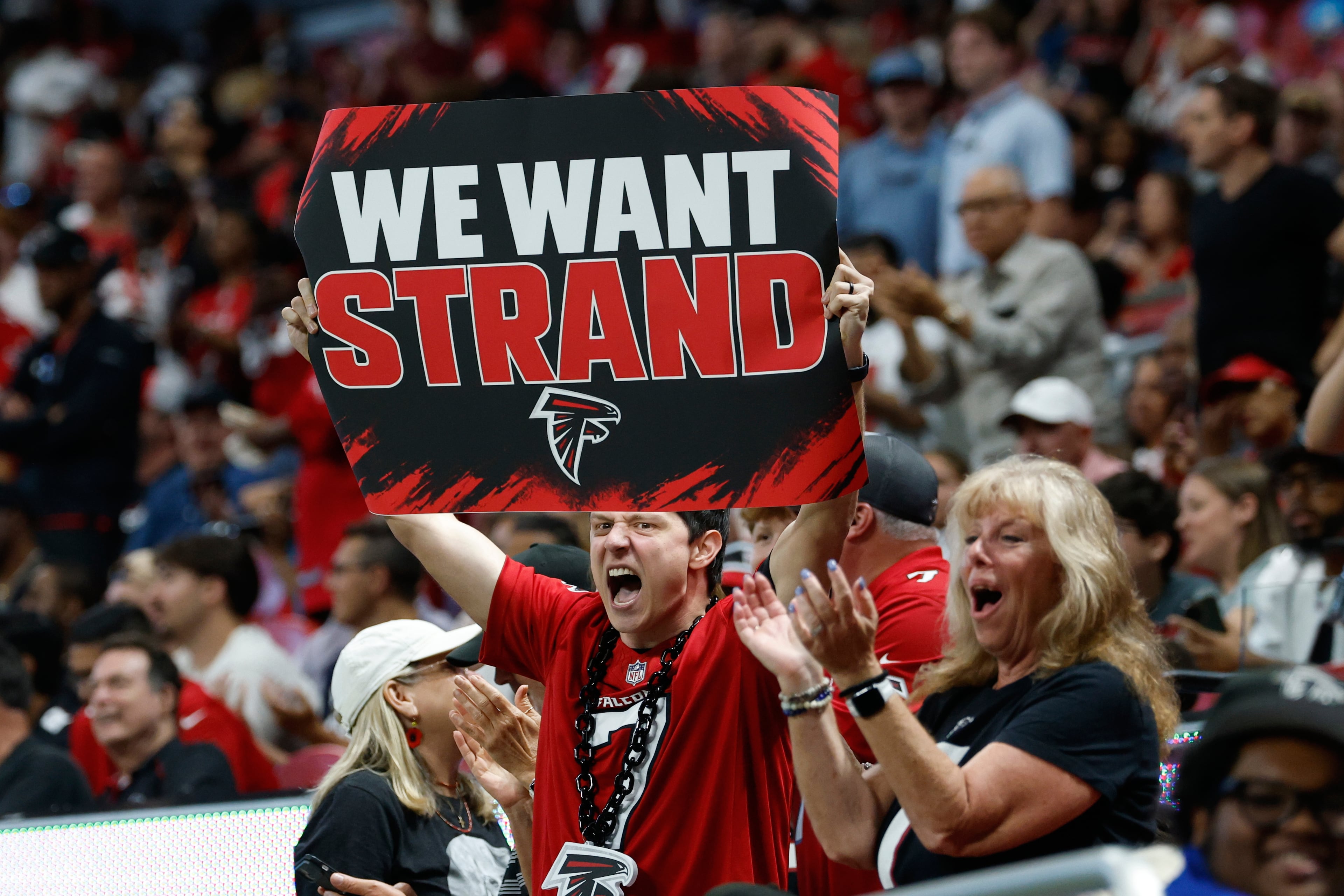 That's one way to fan. (Erik S. Lesser/AP)