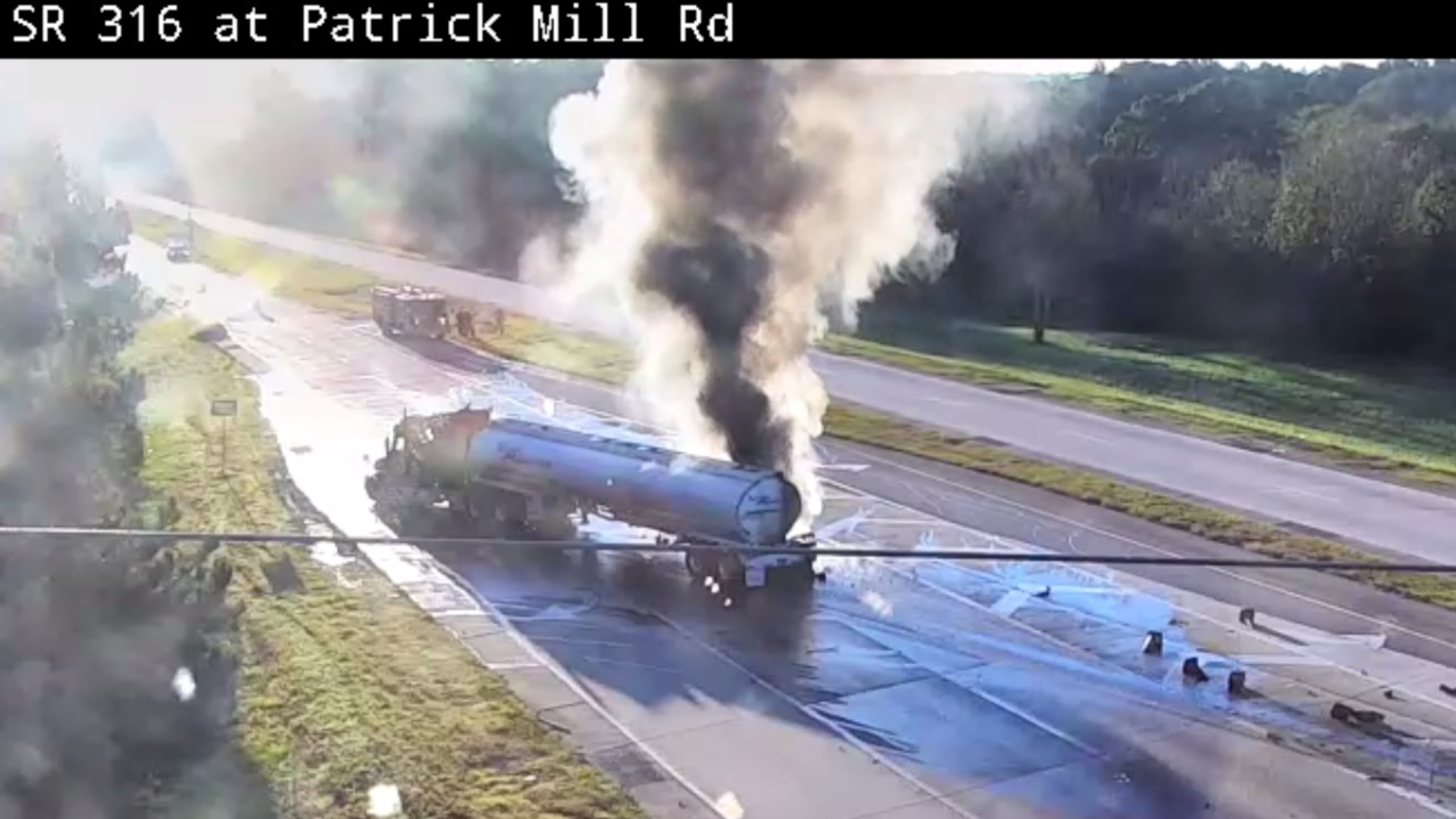 Footage from a Georgia Department of Transportation camera showed heavy black smoke pouring from the tanker at the intersection of Ga. 316 and Patrick Mill Road.