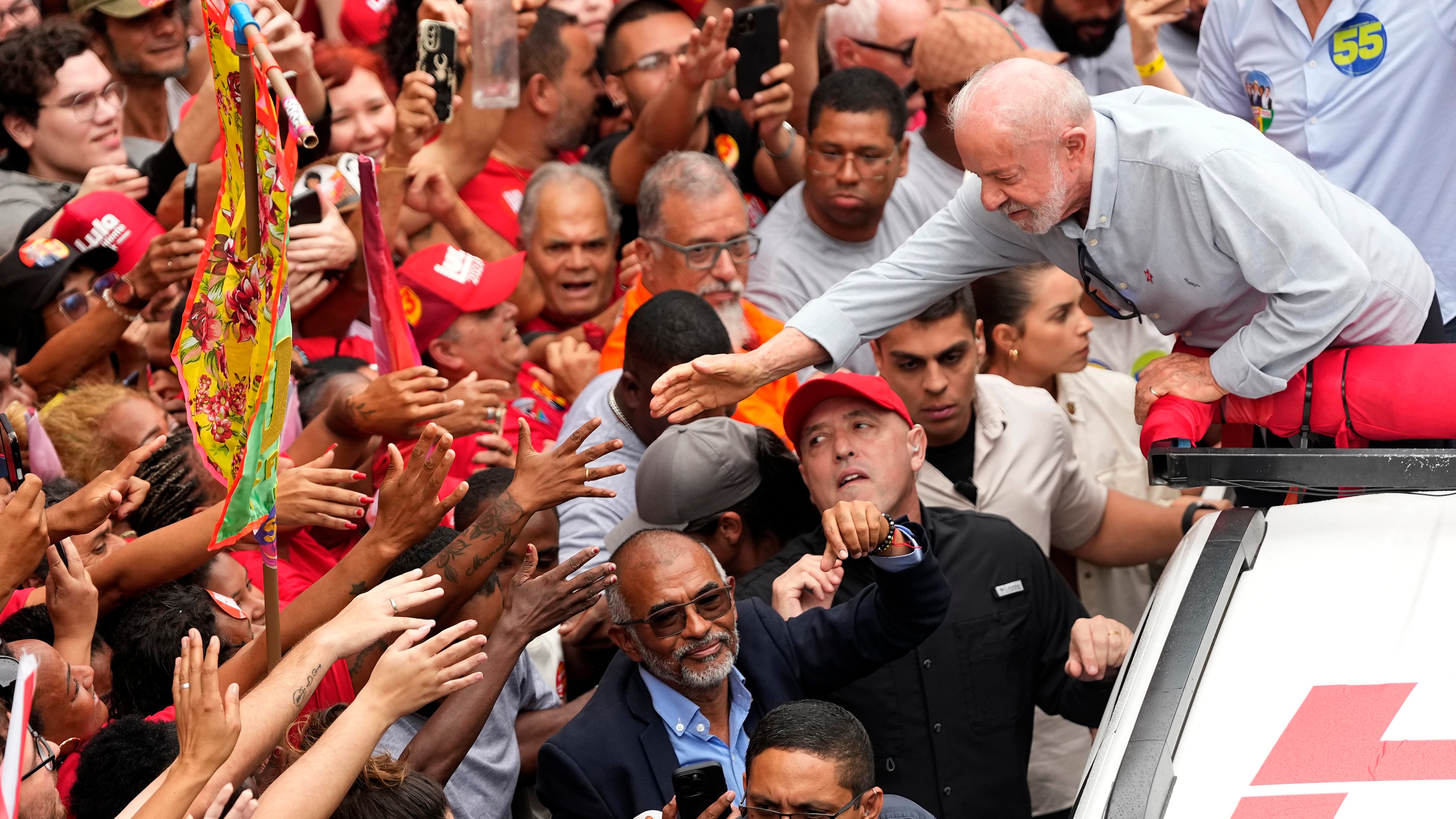 Brazilian President Luiz Inacio Lula da Silva, who is running for reelection, greets supporters during a campaign rally in Rio de Janeiro, Brazil, Friday, Oct. 2, 2026. (AP Photo/Silvia Izquierdo)