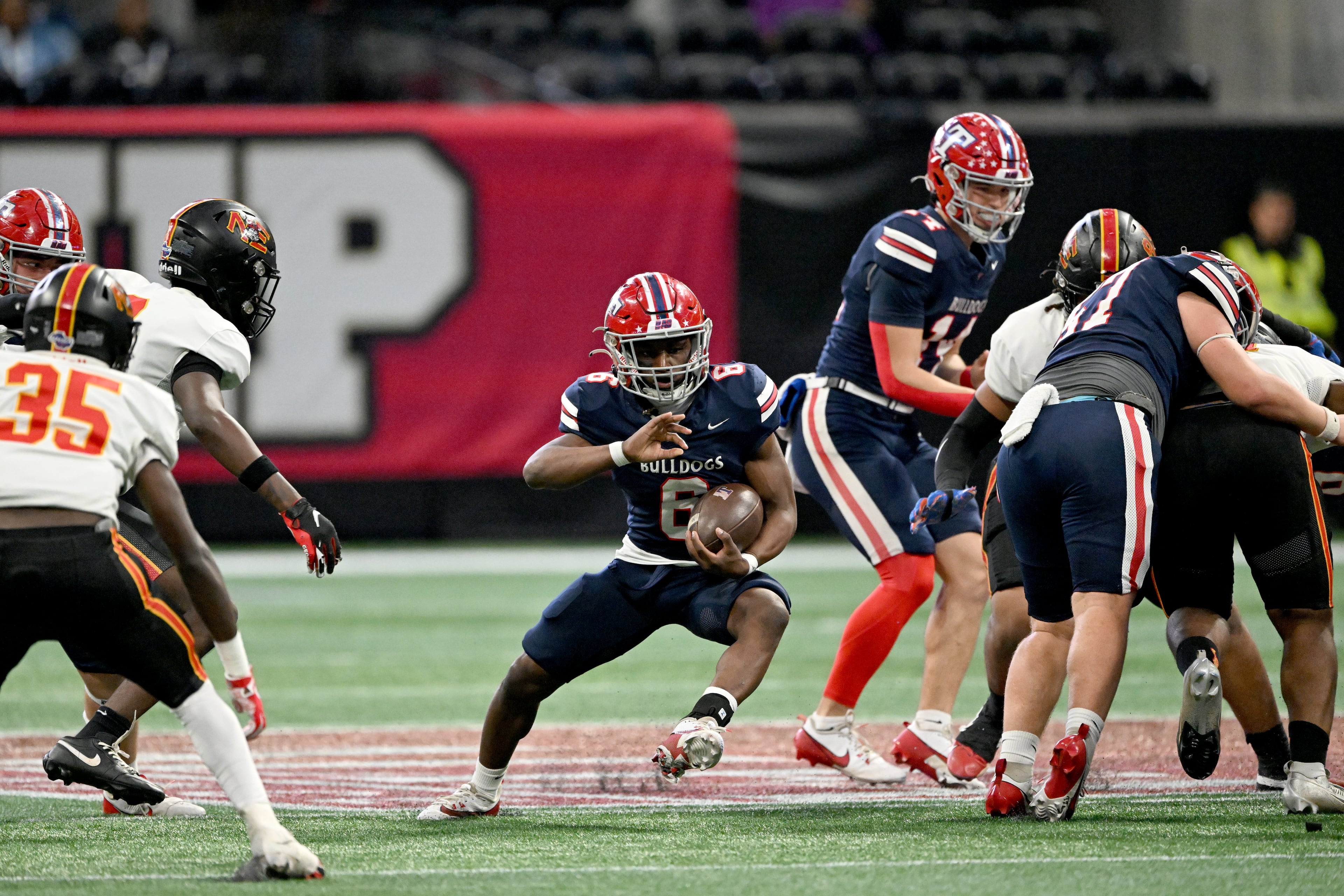 Toombs County's running back Dabvn Wadley (6) runs the ball during the first half in GHSA Class A-Division State Championship game at Mercedes-Benz Stadium, Tuesday, December 17, 2024, in Atlanta. (Hyosub Shin / AJC)