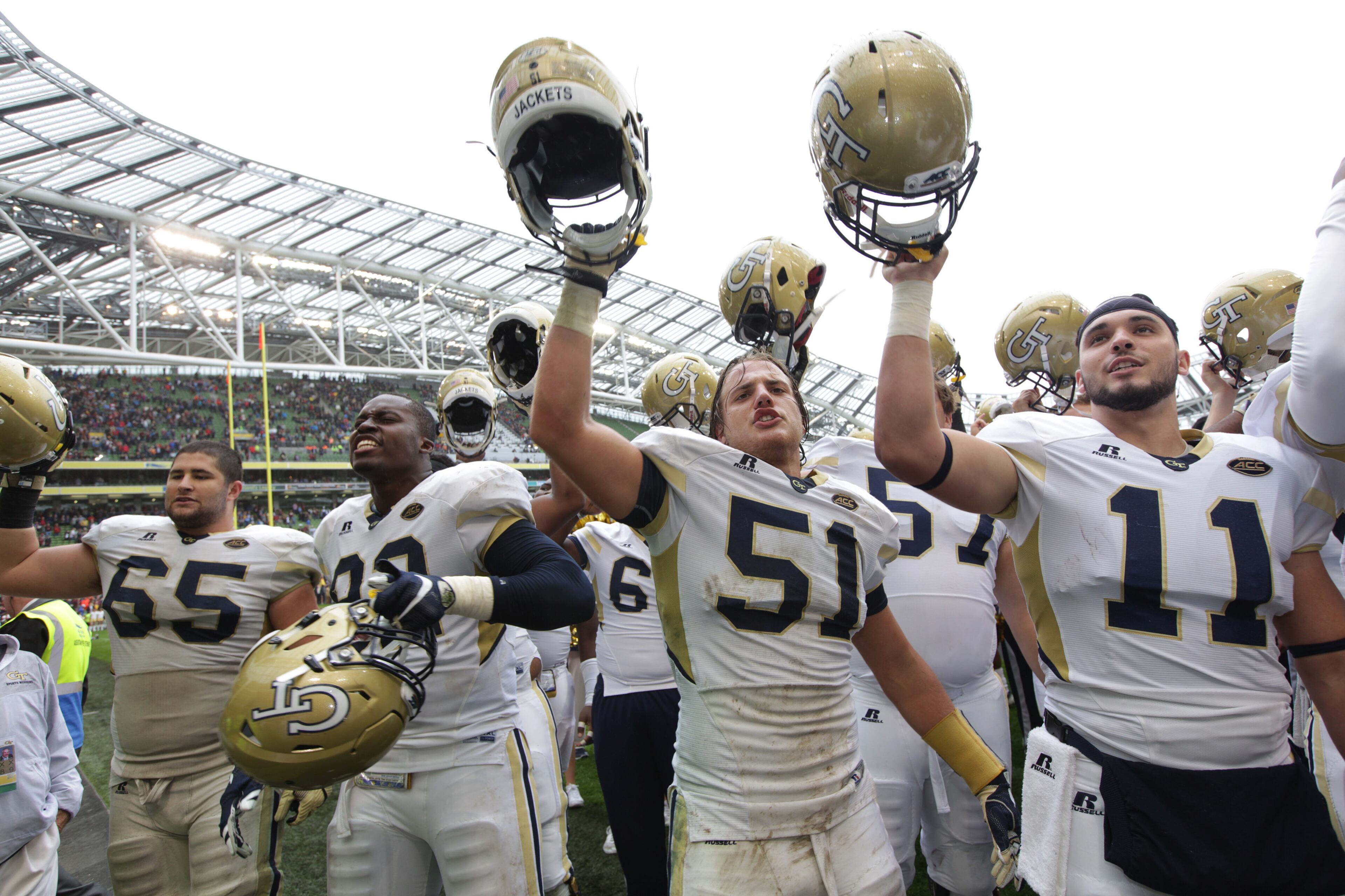 DUBLIN, IRELAND - SEPTEMBER 03: Trey Klock, Franics Kallon, Brant Mitchell and Matthew Jordan of Georgia Tech celebrate victory over Boston College during the Aer Lingus College Football Classic Ireland 2016 at Aviva Stadium on September 3, 2016 in Dublin, Ireland. (Photo by Patrick Bolger/Getty Images)