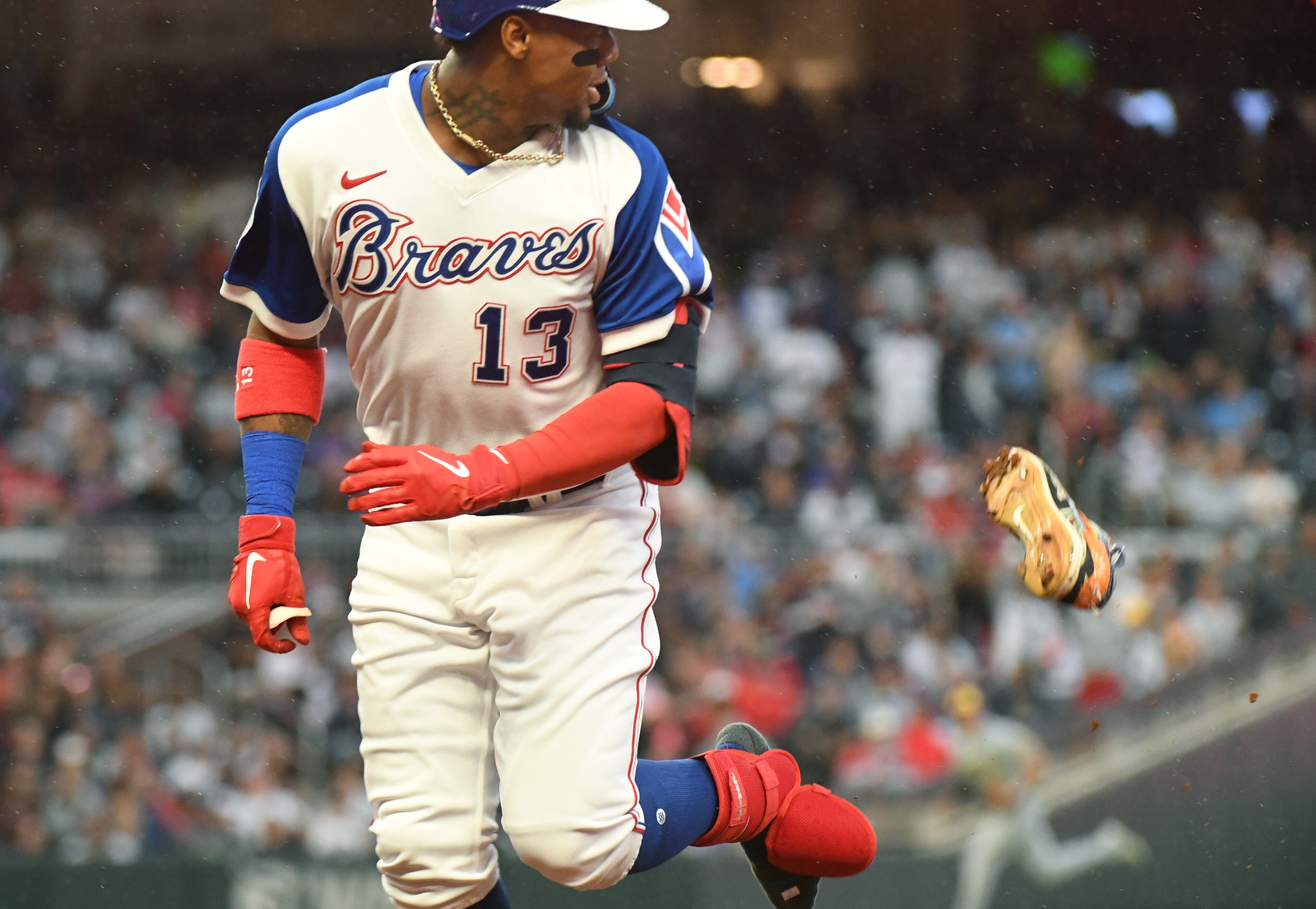 May 7, 2022 Atlanta - Atlanta Braves' right fielder Ronald Acuna Jr. (13) runs to the first base as he looses his shoe after hitting a single in the first inning at Truist Park on Saturday, May 7, 2022. (Hyosub Shin / Hyosub.Shin@ajc.com)