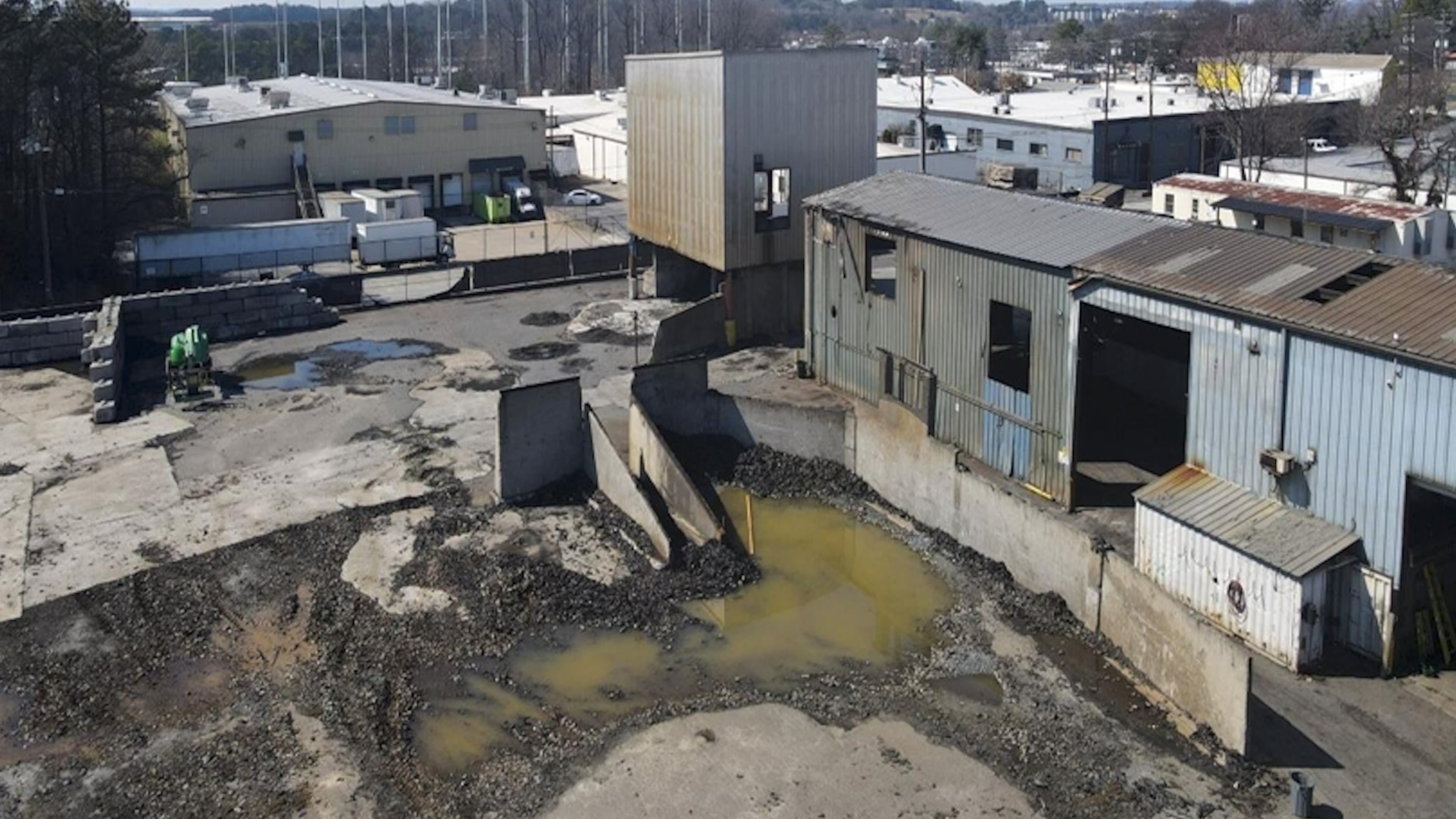 This is a photo of a tire recycling facility along Huber Street in Atlanta that a development team aims to transform into an apartment complex called Alta West Midtown. (Courtesy of Development Authority of Fulton County / Wood Partners)