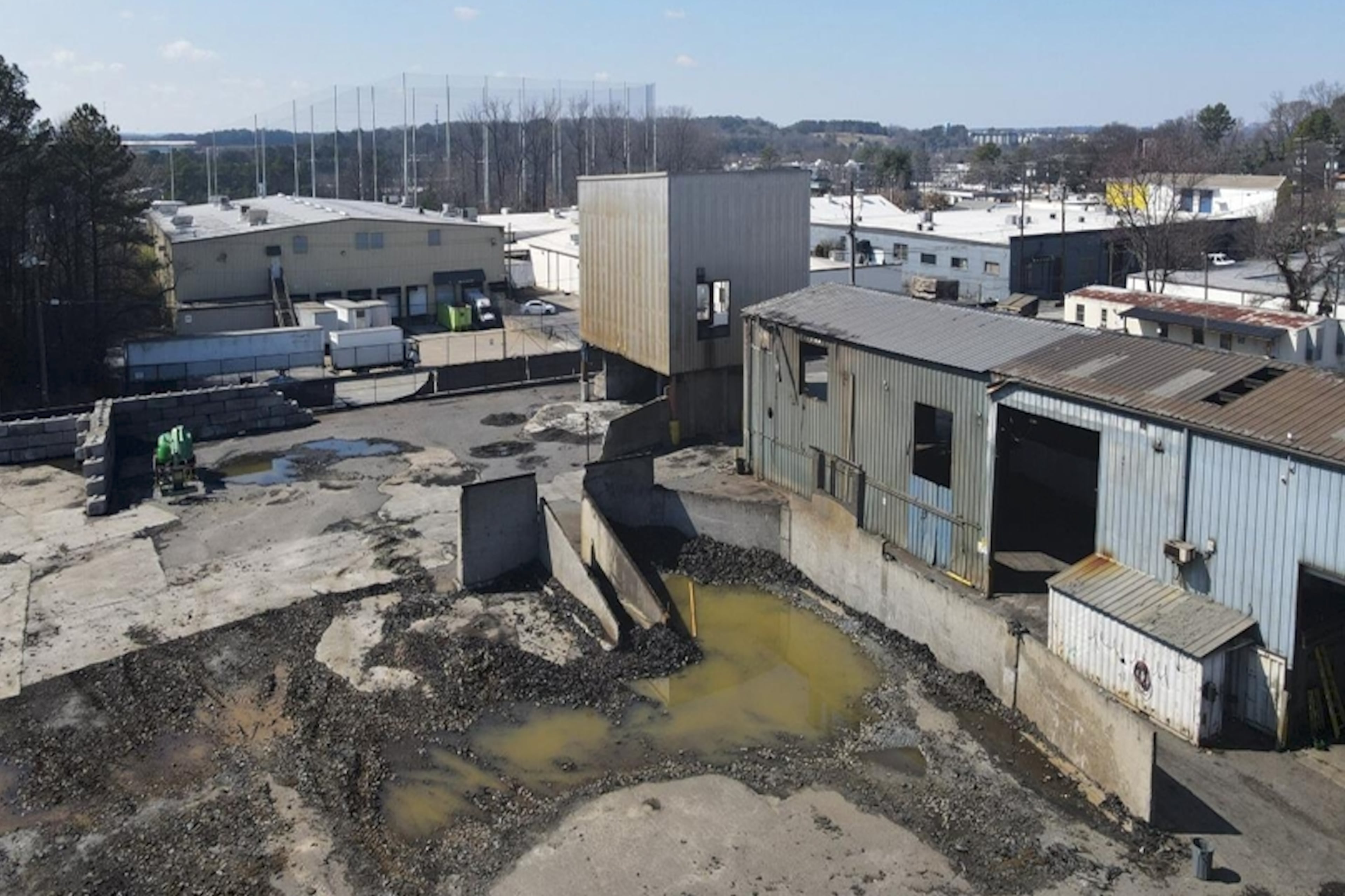 This is a photo of a tire recycling facility along Huber Street in Atlanta that a development team aims to transform into an apartment complex called Alta West Midtown. (Courtesy of Development Authority of Fulton County / Wood Partners)