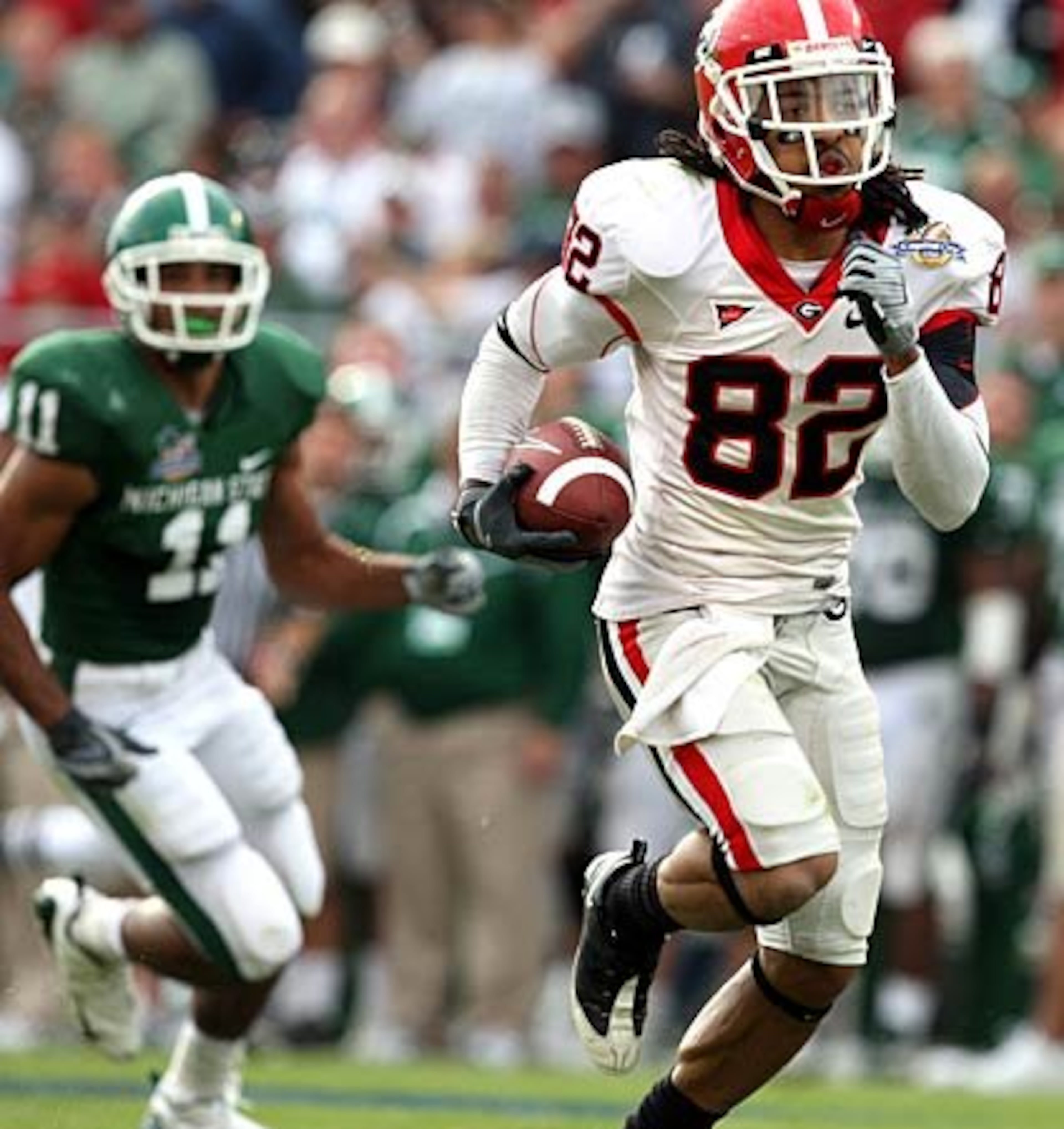 Georgia wide receiver Michael Moore (82) runs for a touchdown in the third quarter against Michigan State.