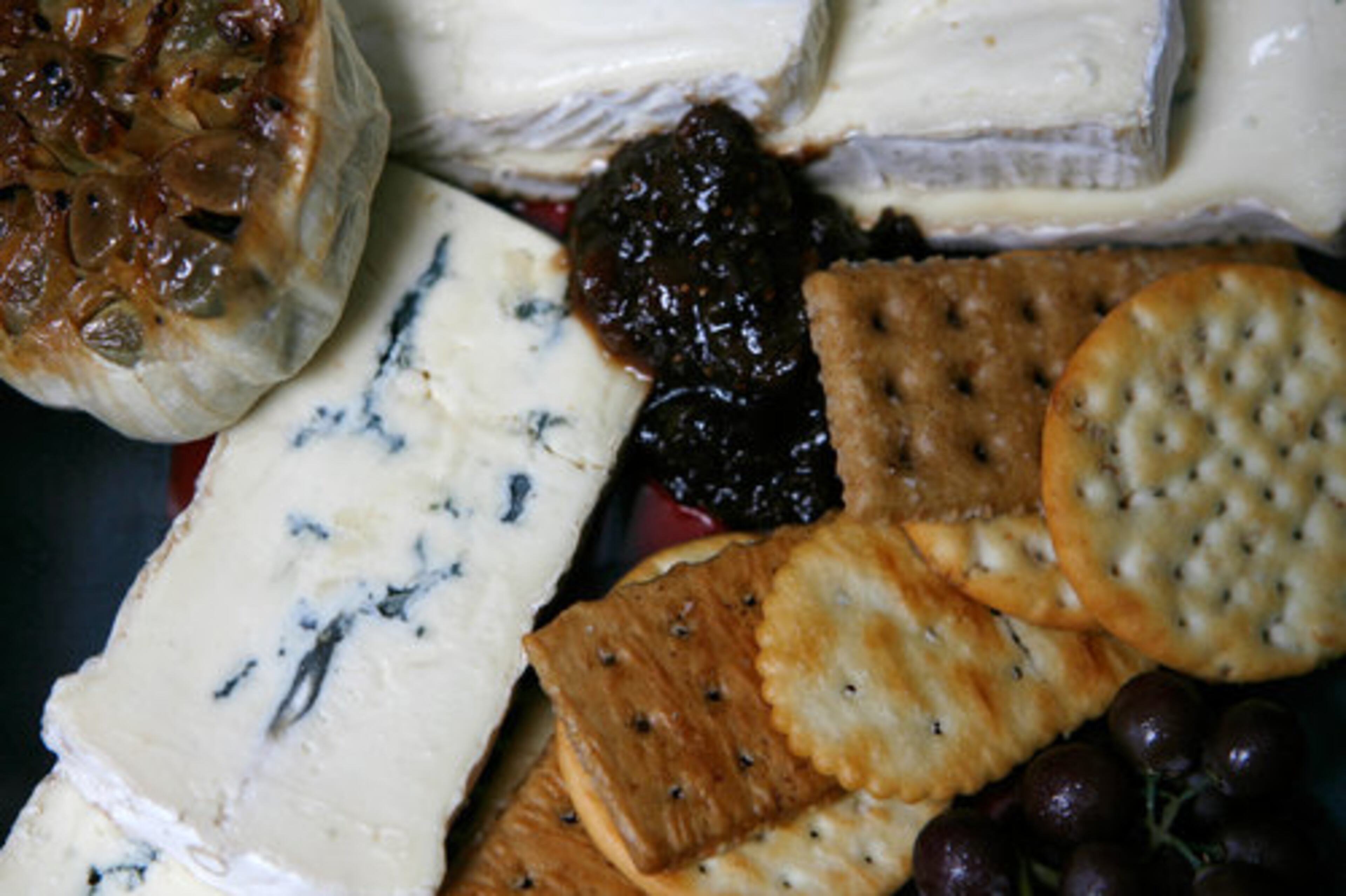 Cambozola cheese served with roasted garlic, crackers and a fruit compote -- all part of the $60 sunset picnic basket, which is available at all Atlanta Symphony Orchestra and ASO Presents concerts at the Verizon Wireless Amphitheatre at Encore Park in Alpharetta. Styled by Ovations Food Service chef Phil Alamio.