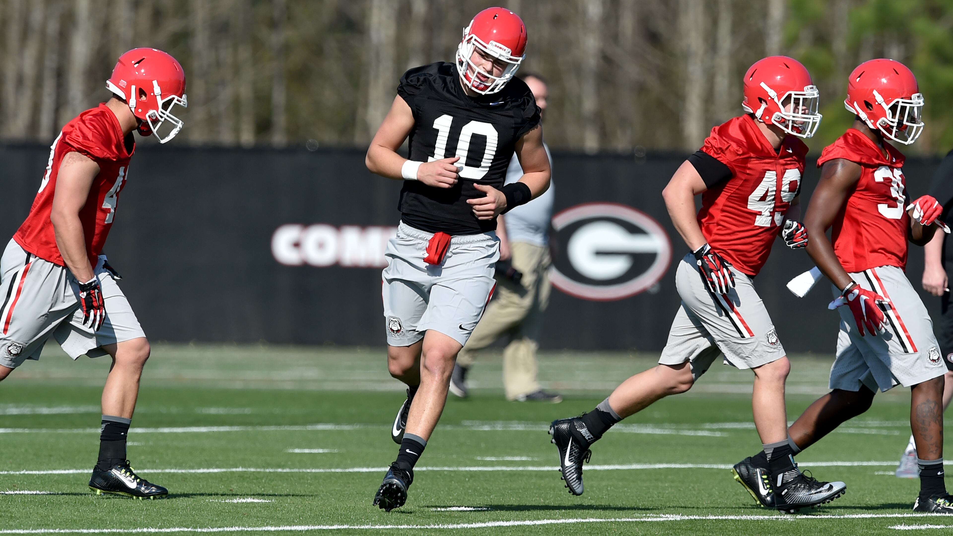 Eason runs a drill on the first day of spring practice. Click here to read about the Bulldogs at Dawgnation.com. BRANT SANDERLIN/BSANDERLIN@AJC.COM